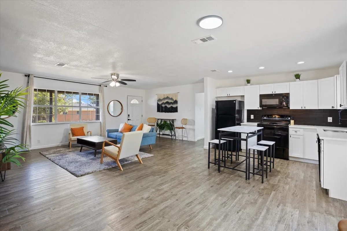 Living room opens to the kitchen with breakfast area.