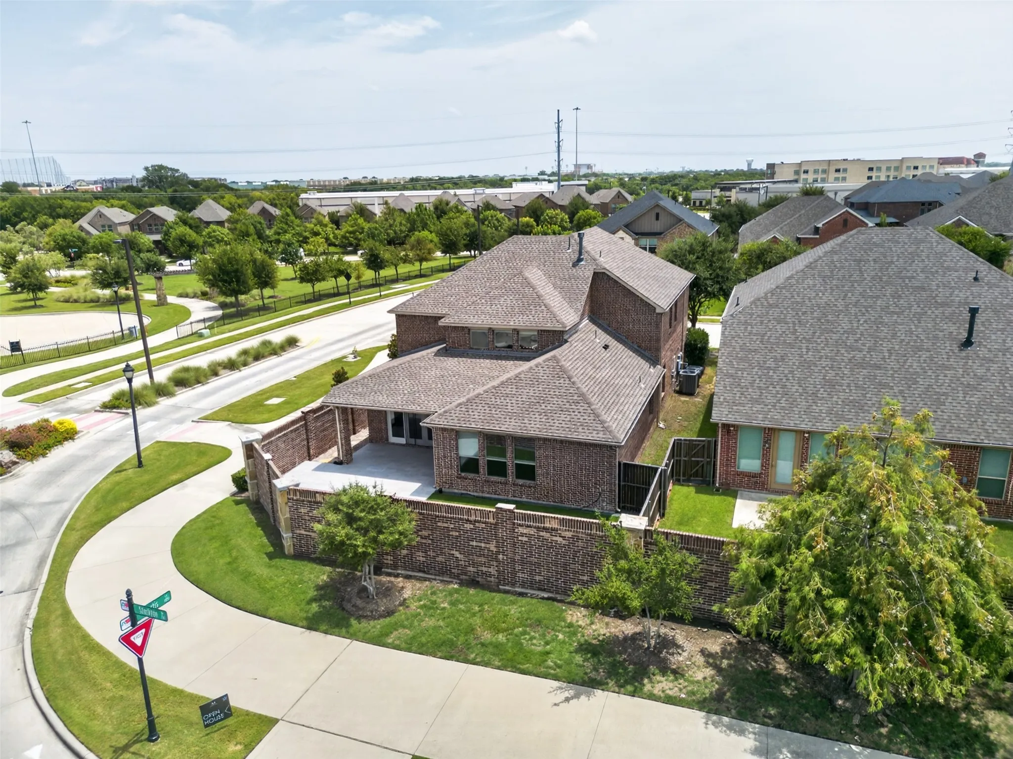 Brick exterior with a covered patio and private fenced yard