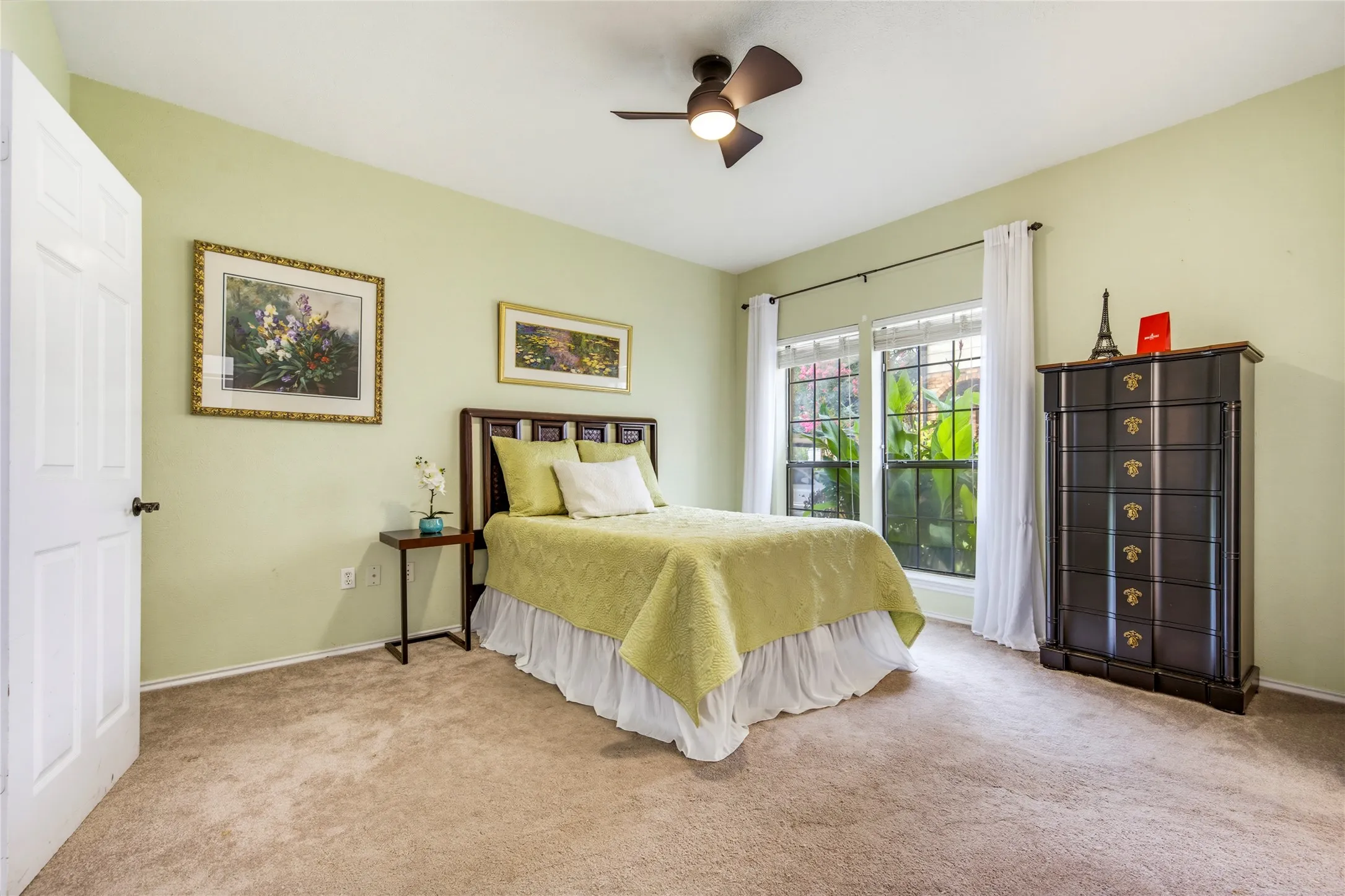 Primary bedroom with lovely sage green paint....