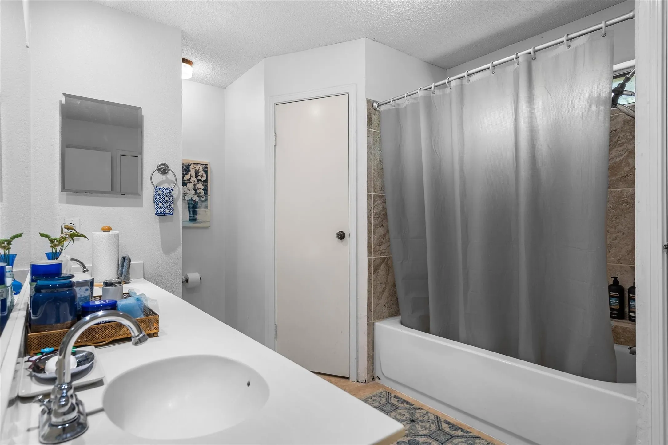 Built-in vanity with an integrated sink and chrome faucet
