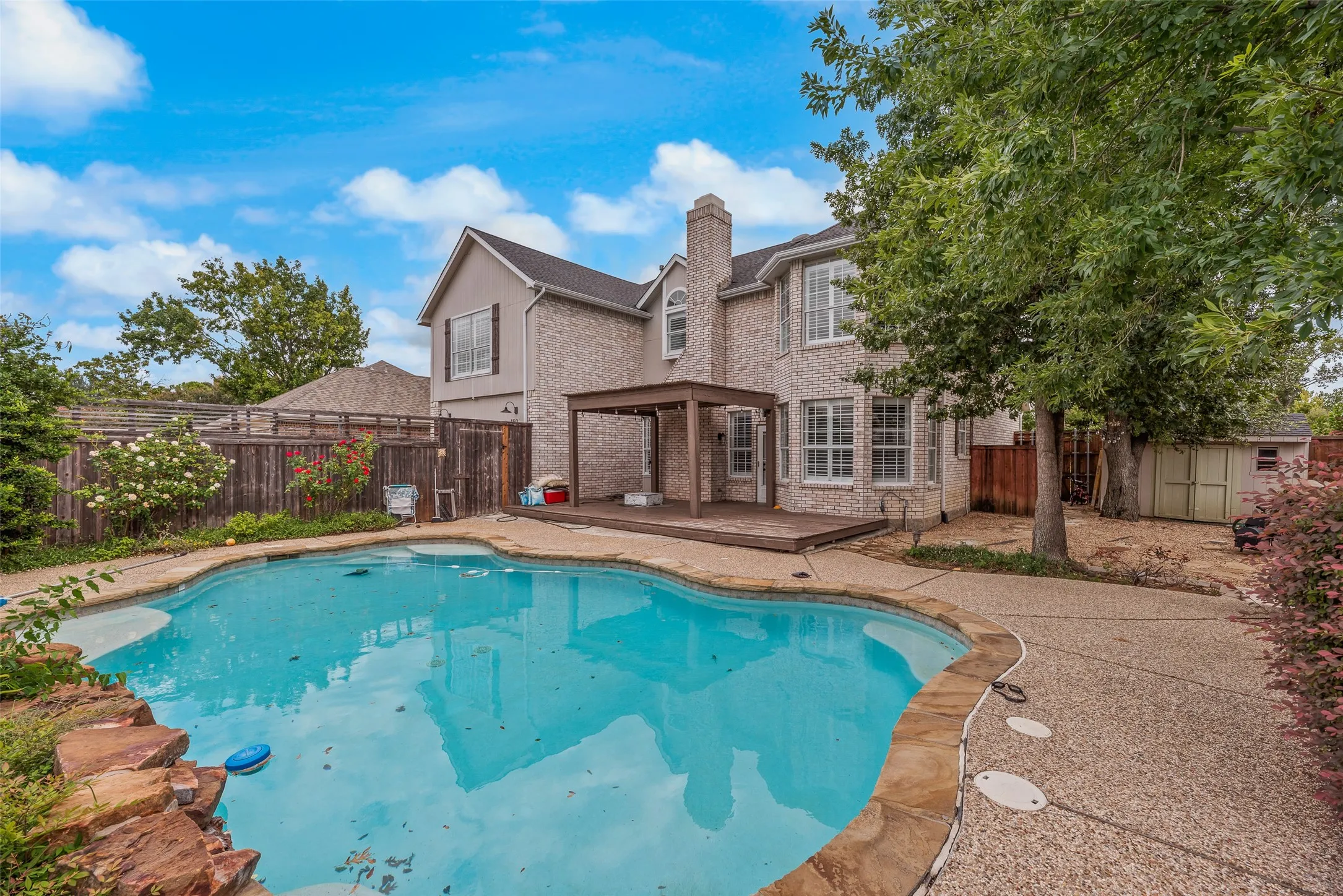 Brick-clad exterior with a two-story design and chimney feature