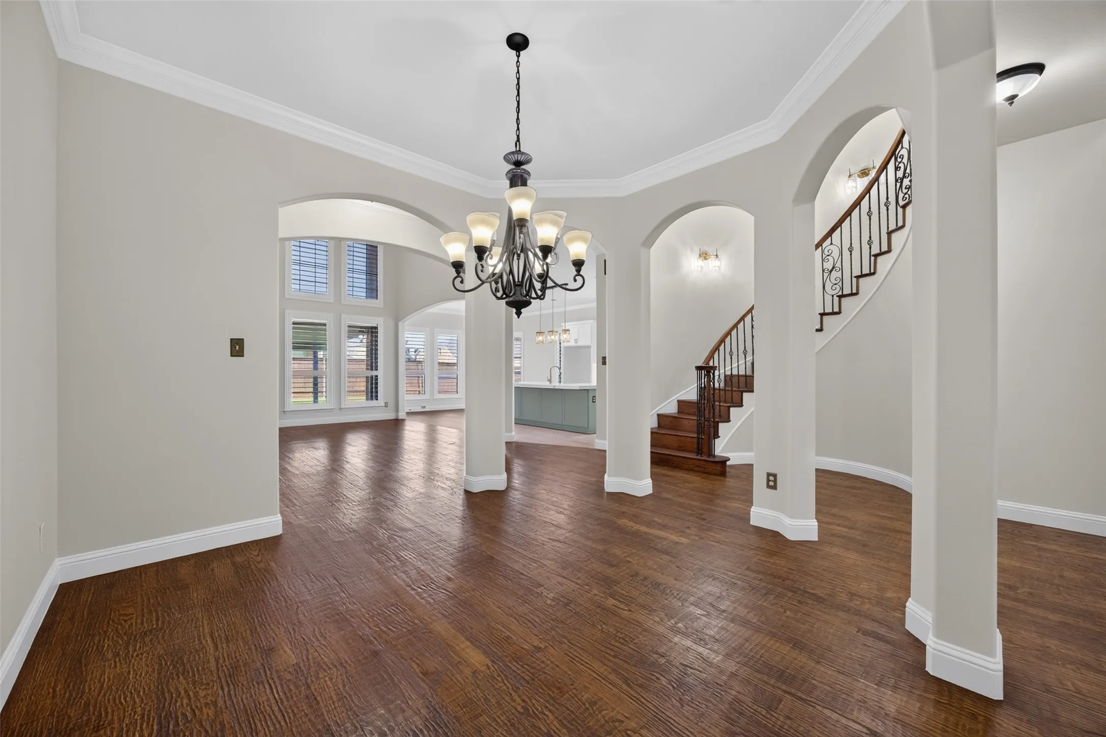 Open-concept formal dining with pillars for a rich look!