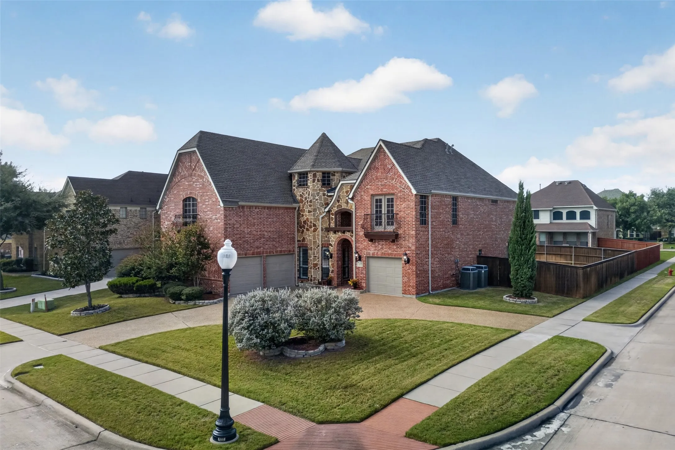 HUGE corner lot with oversized circle drive and separate garages.