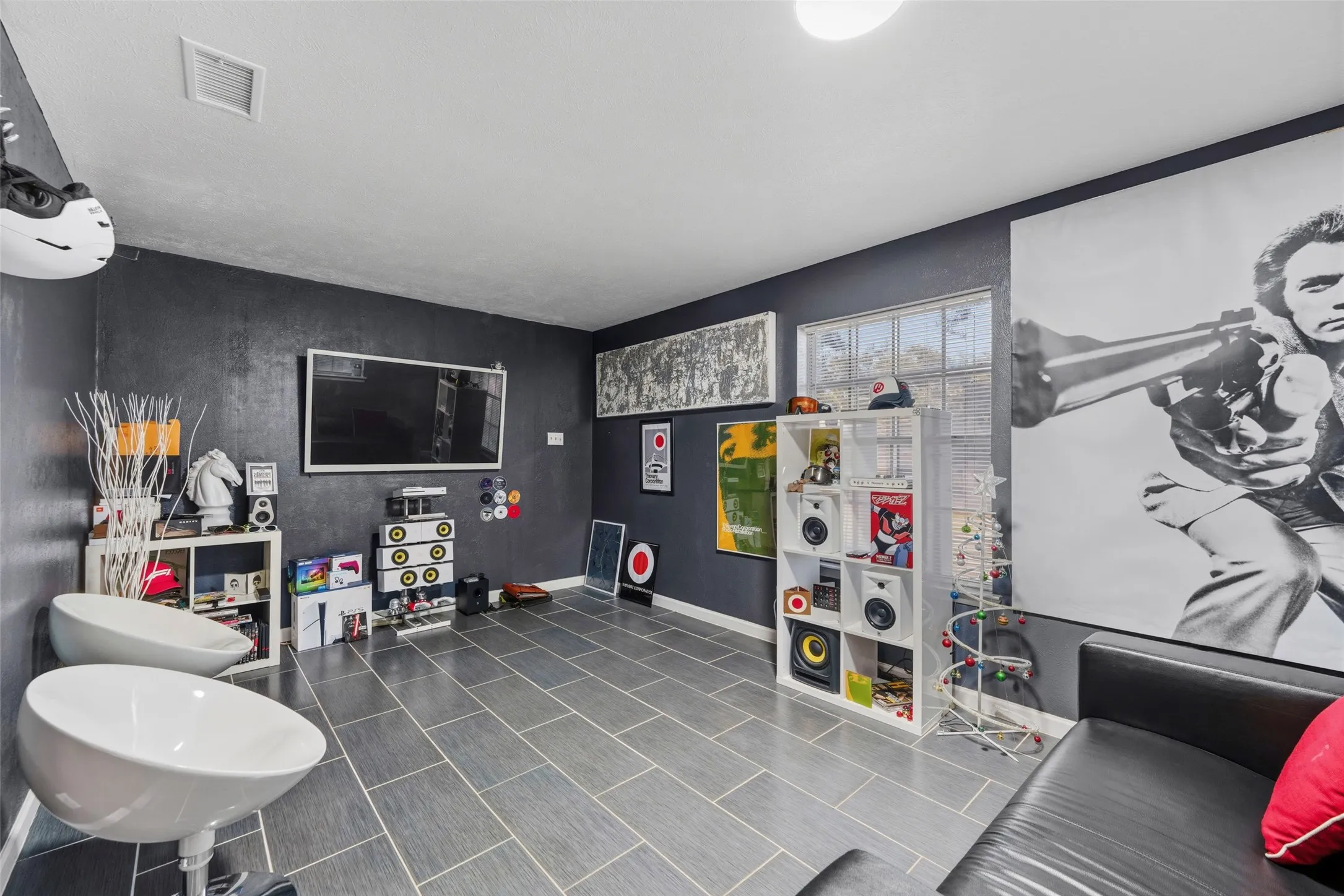 Recessed lighting, tiled flooring, built-in shelving, window with natural light, and dark-toned walls