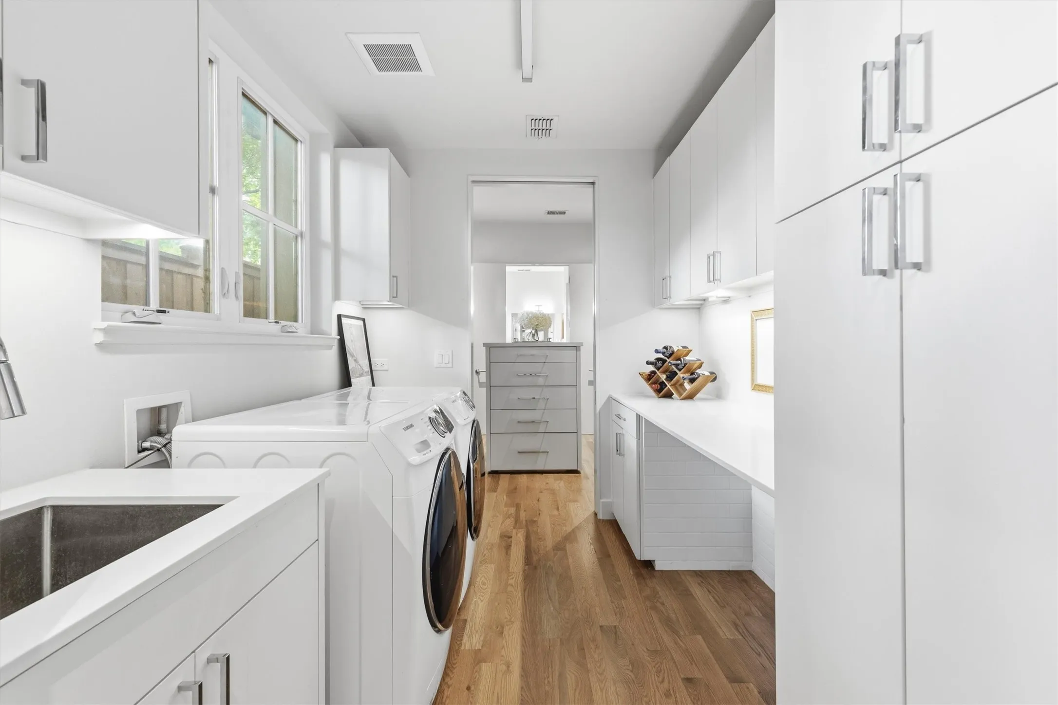 The first-floor laundry connects to the primary bedroom closet