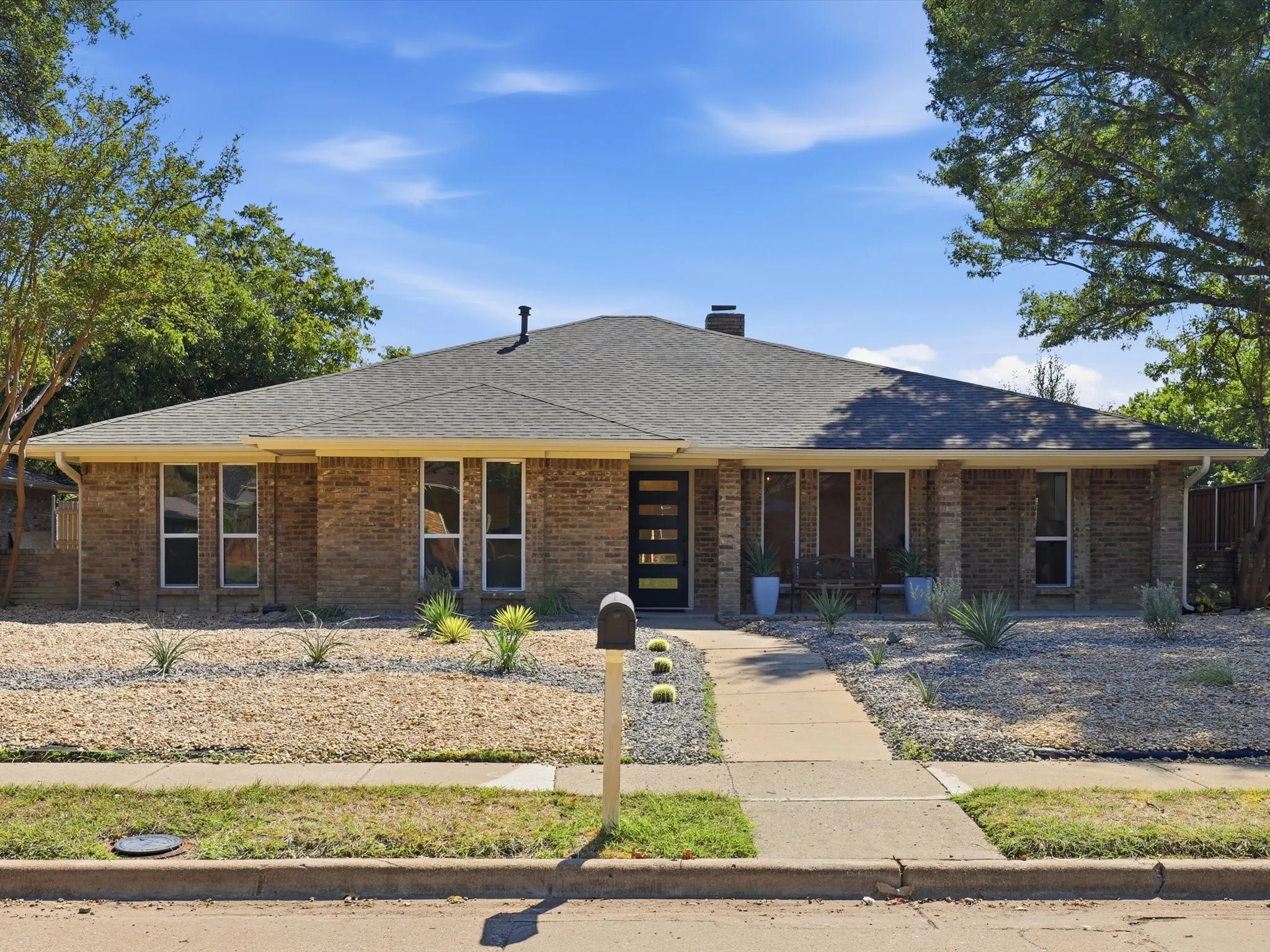 Brick exterior with a dark-pitched roof