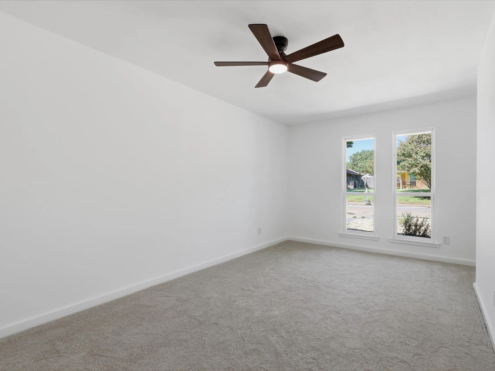 Carpeted flooring with white walls and trim