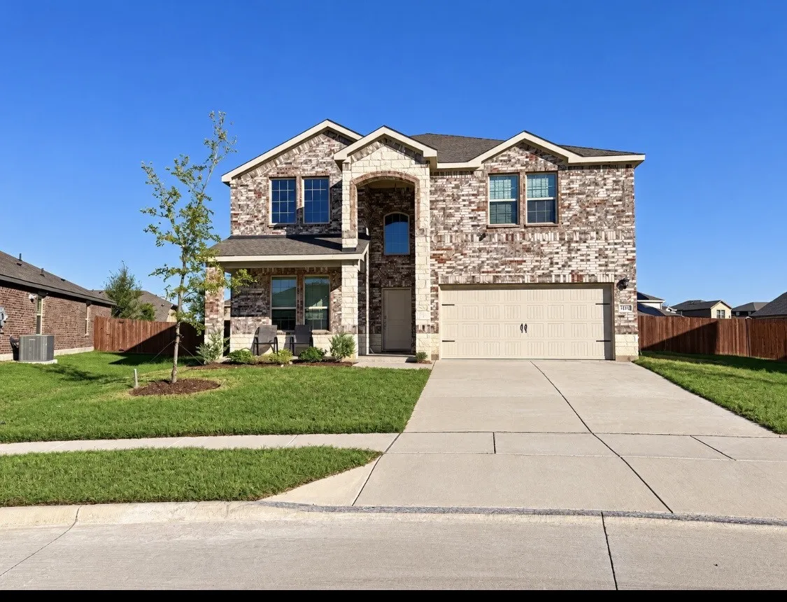 Brick and stone veneer exterior with gabled roof lines