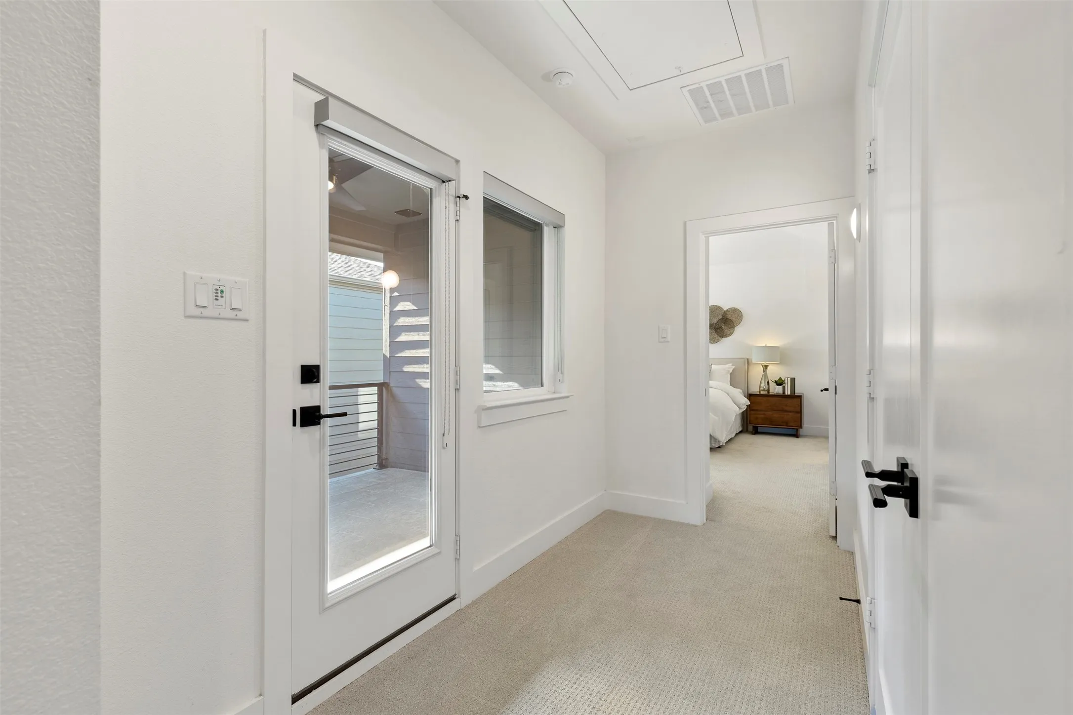 This private, expansive second-level outdoor patio serves as a serene retreat, offering an ideal space for enjoying your morning coffee or simply unwinding and relaxing in a peaceful, elevated setting.