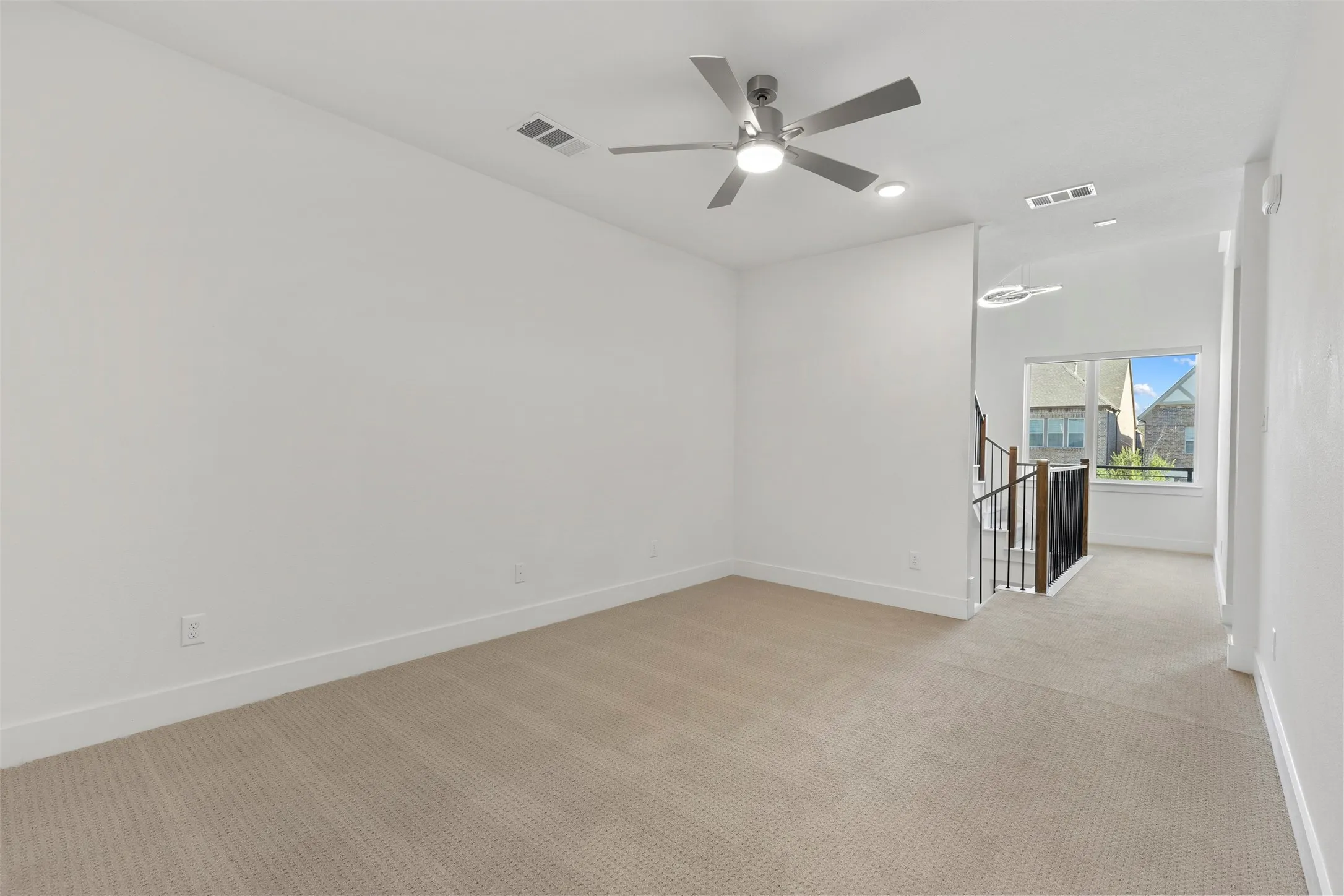 This expansive and versatile bonus room offers endless possibilities, featuring ample natural light, high-quality finishes, and plenty of space to serve as a media room, play area, or secondary living space.