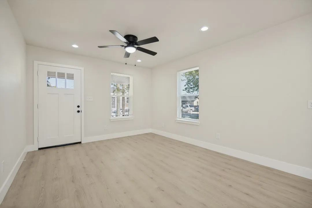 Light wood-finish flooring, recessed lighting, and a ceiling fan