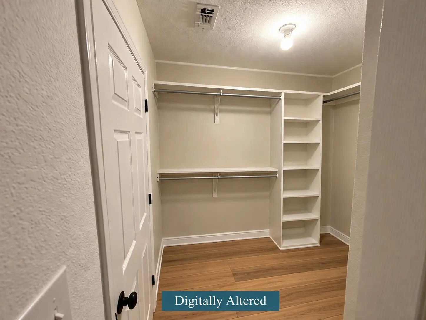 Built-in closet system featuring shelving and hanging rods, wood-finish flooring, and a panel door with dark hardware-digitally altered to remove clothing