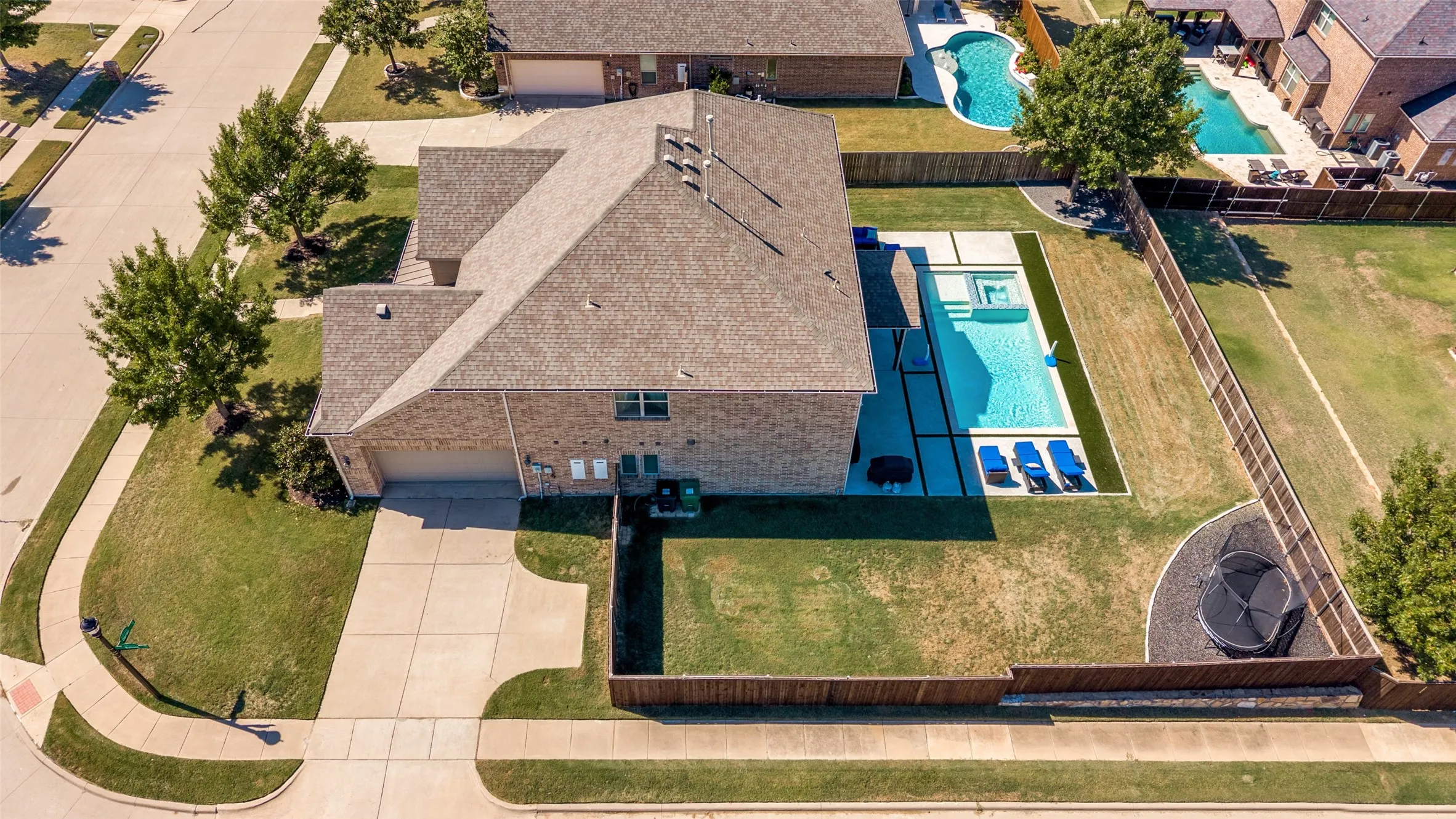 Brick exterior residence with an asphalt shingle roof