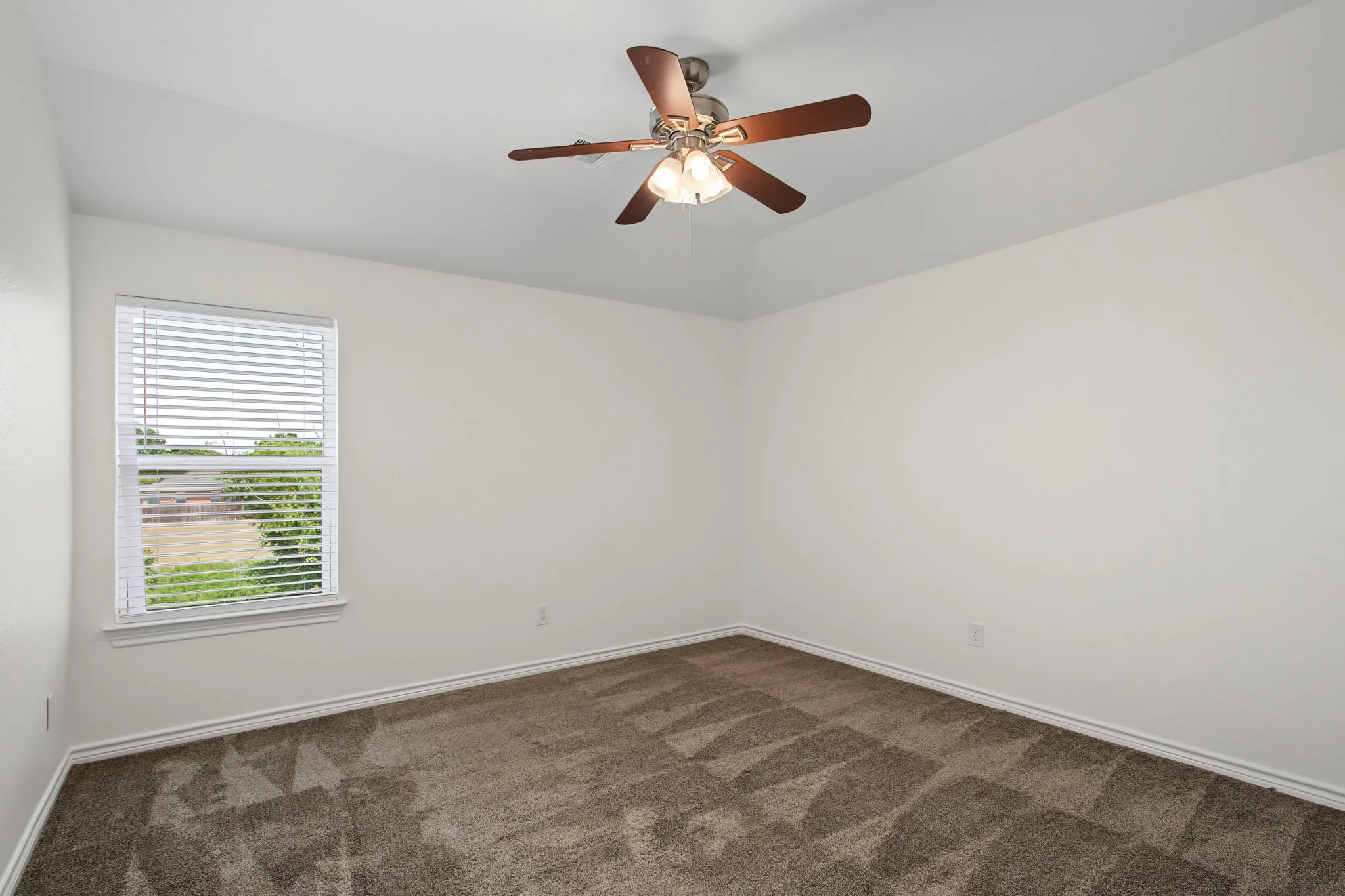 Tray ceiling with an integrated ceiling fan and light fixture