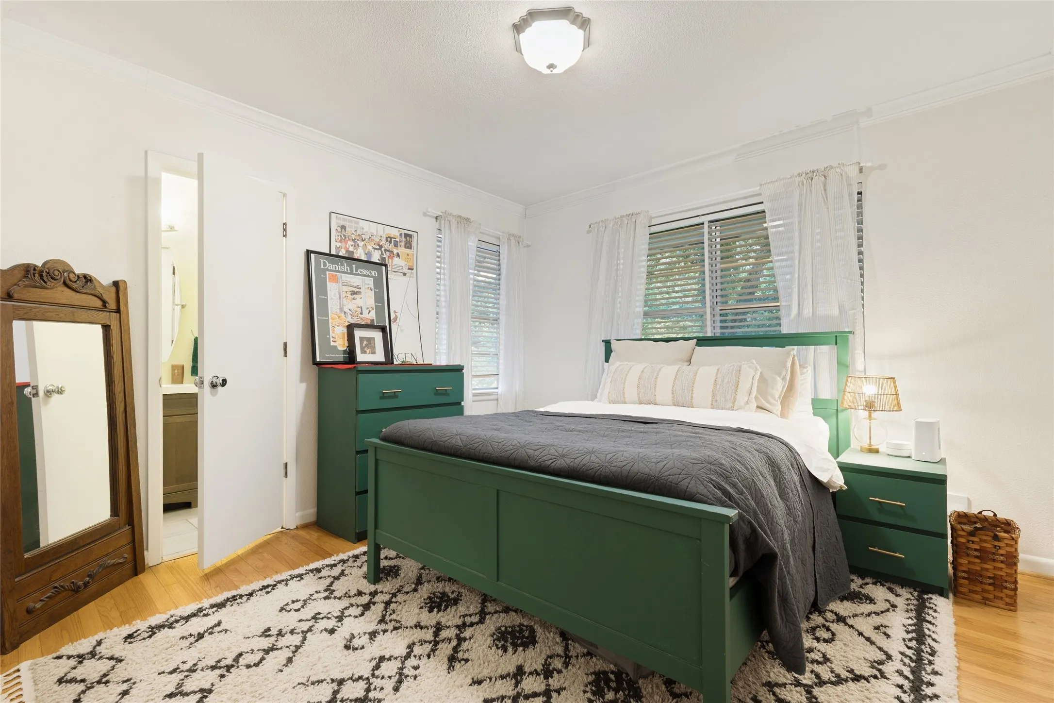 Hardwood floors and generous natural light continue into the Guest Bedroom.