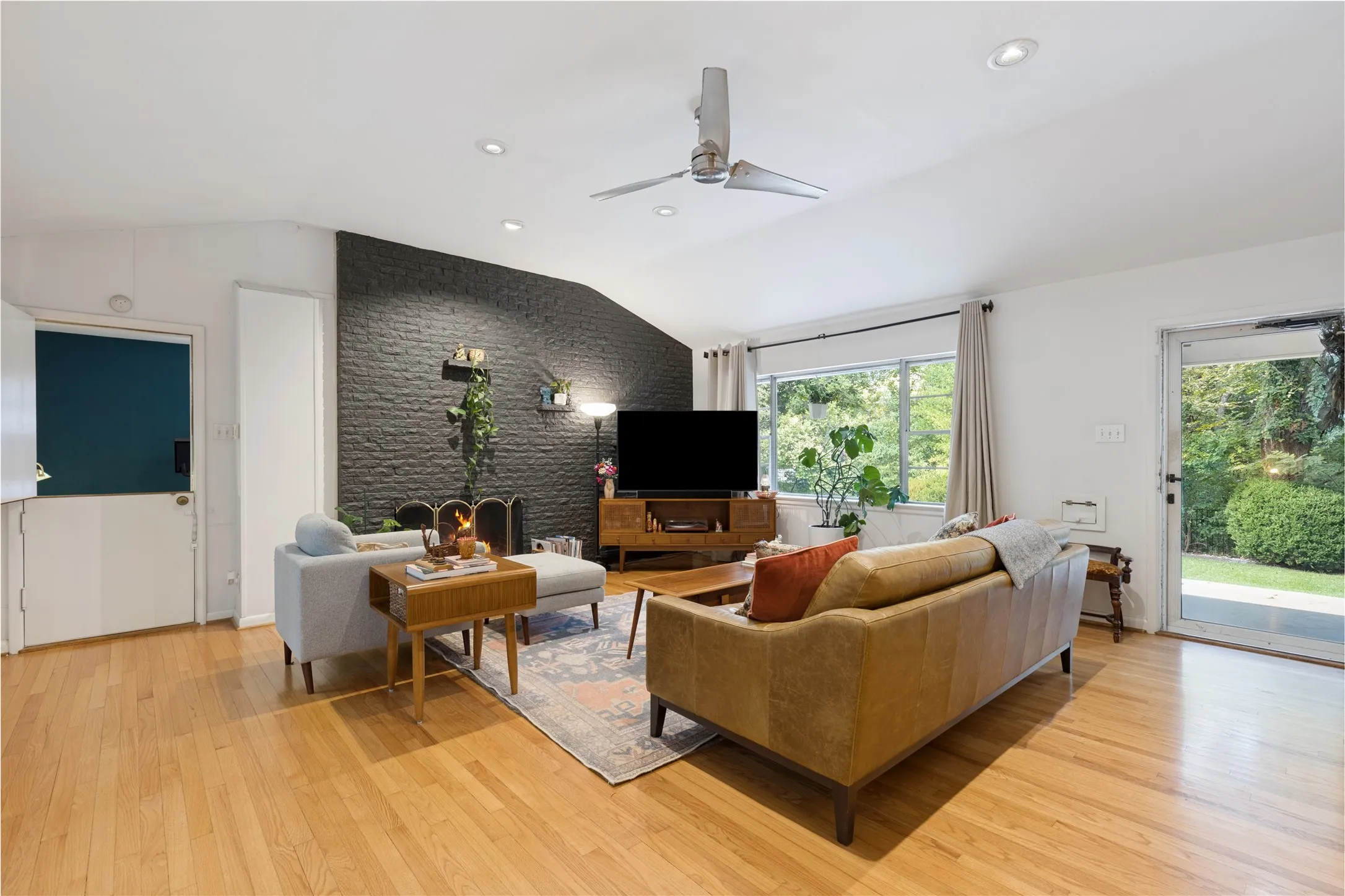 The vaulted Living Room introduces the home’s wonderful sense of volume, light and midcentury character.