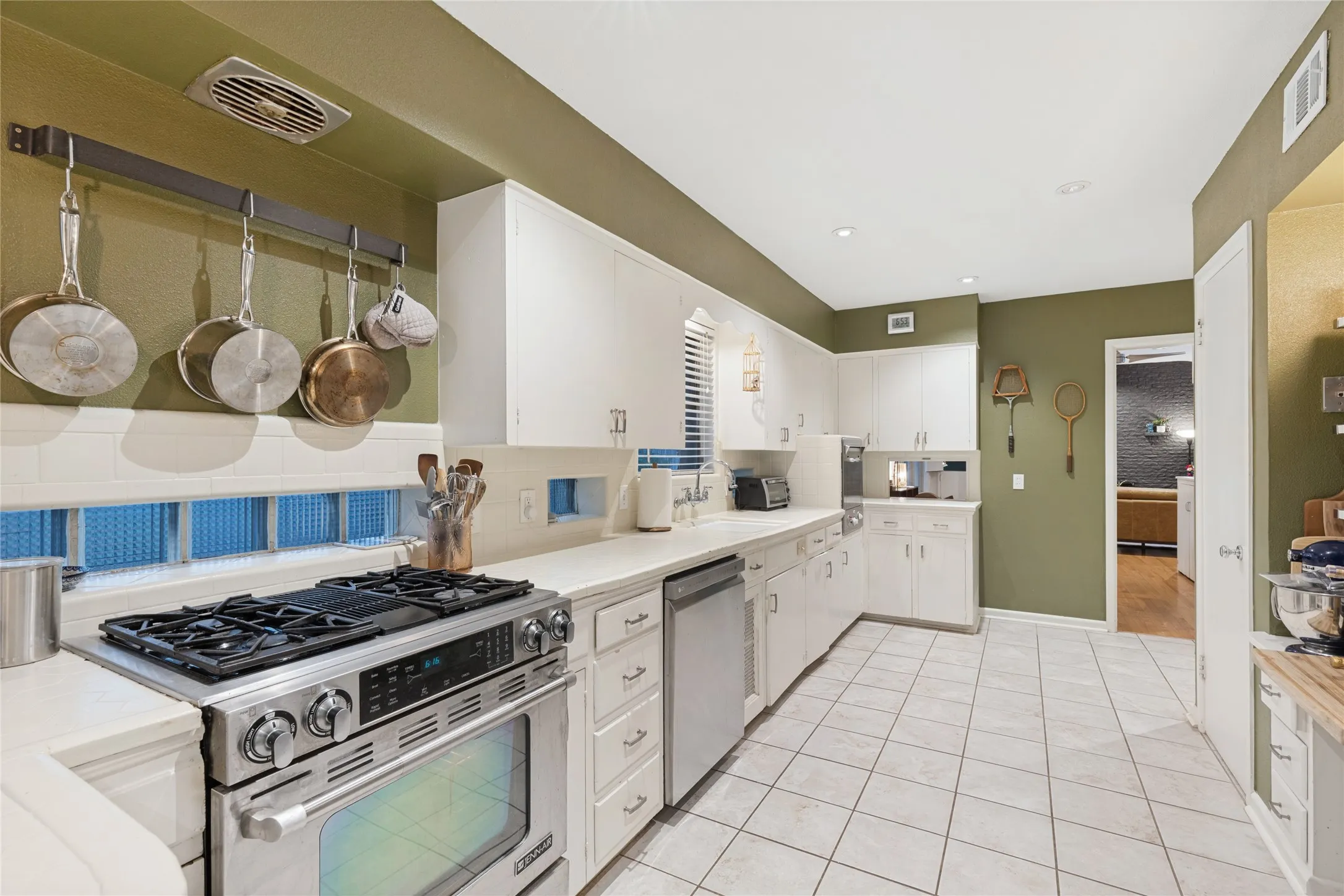 An original built-in desk adds both function and vintage character to the Kitchen.