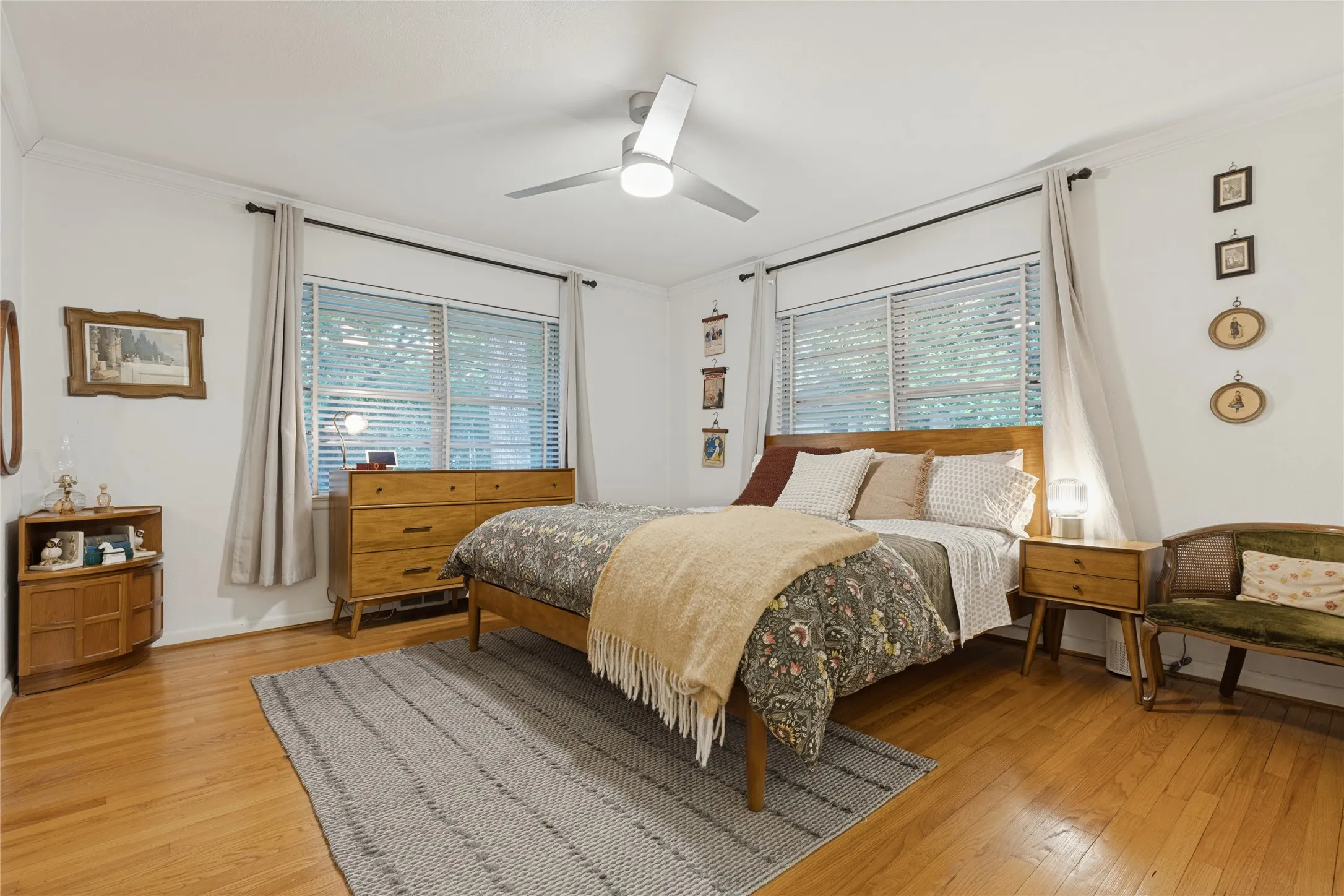 The Primary Bedroom combines hardwood floors, abundant natural light and peaceful views into the trees.