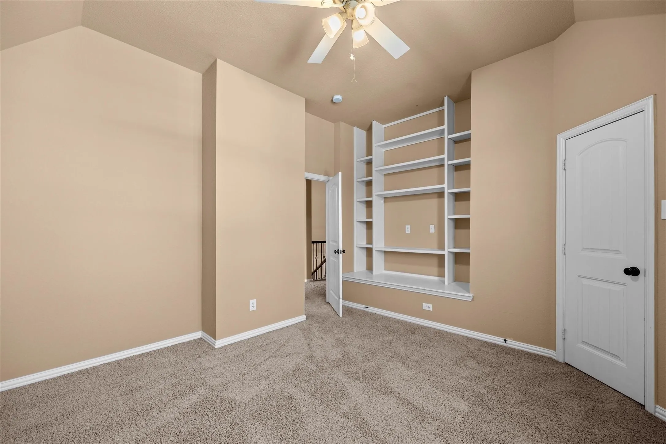 Built-in shelving gives this bedroom a special place for books, keepsakes, and favorite collections!