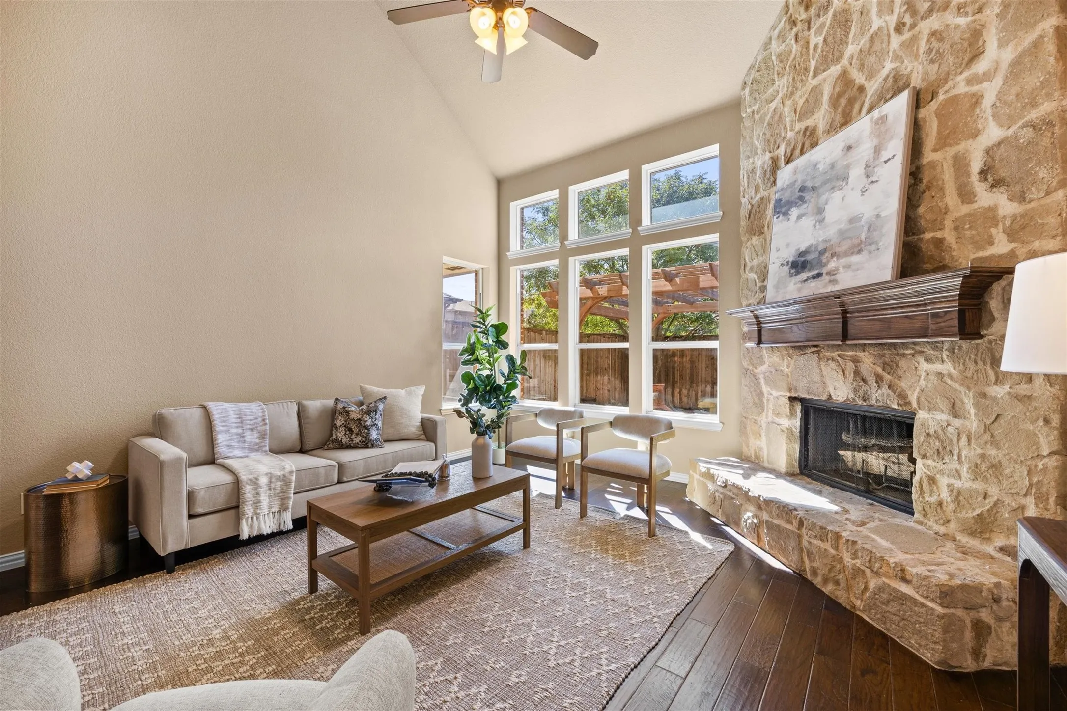 A floor-to-ceiling stone fireplace creates a beautiful focal point for cozy evenings at home.
