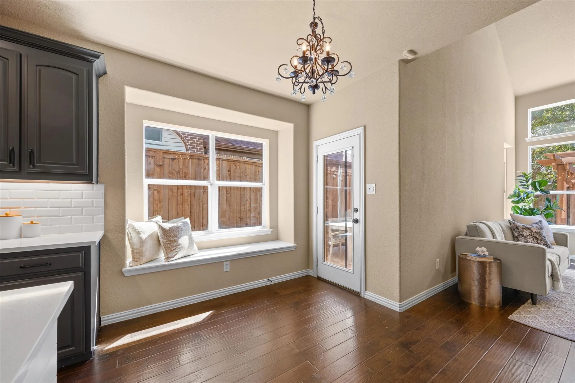 A built-in window seat adds charm to the breakfast nook, with the patio door just steps away.