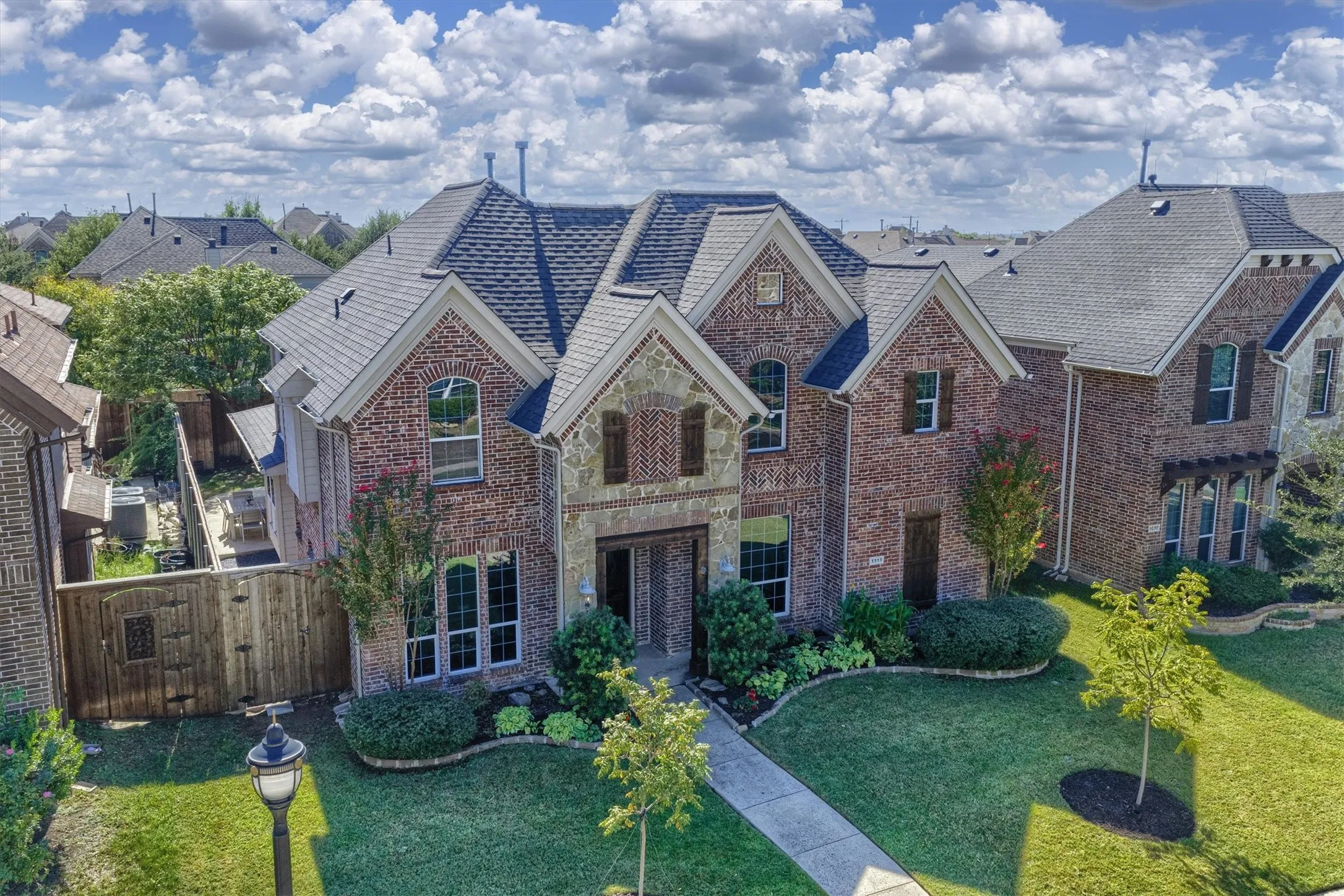 Peaked rooflines and tall windows give this home a striking presence from the street.