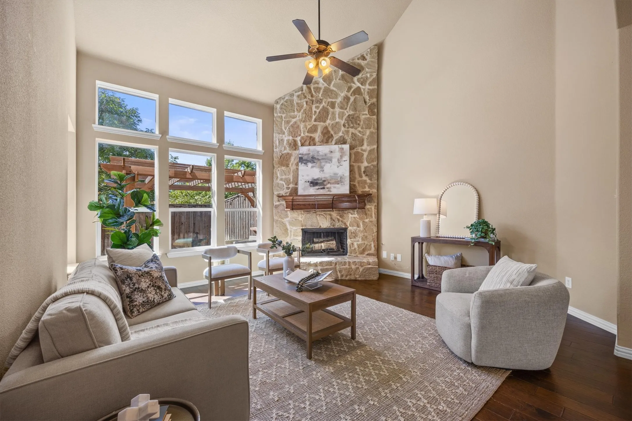 Soaring ceilings and tall windows give the family room a wonderfully bright and spacious feel!