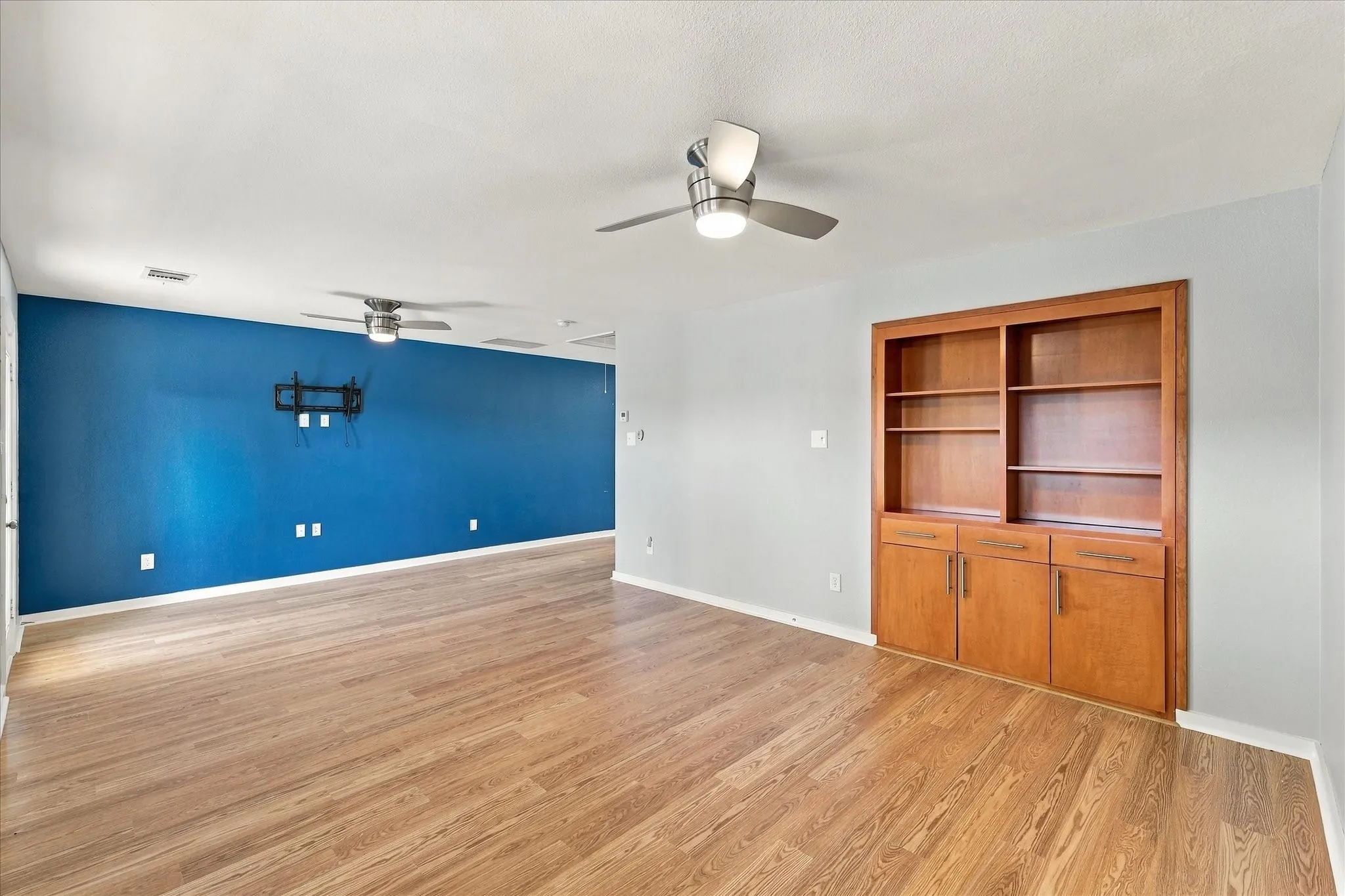 Loft leads to this game room which has a balcony off of it.