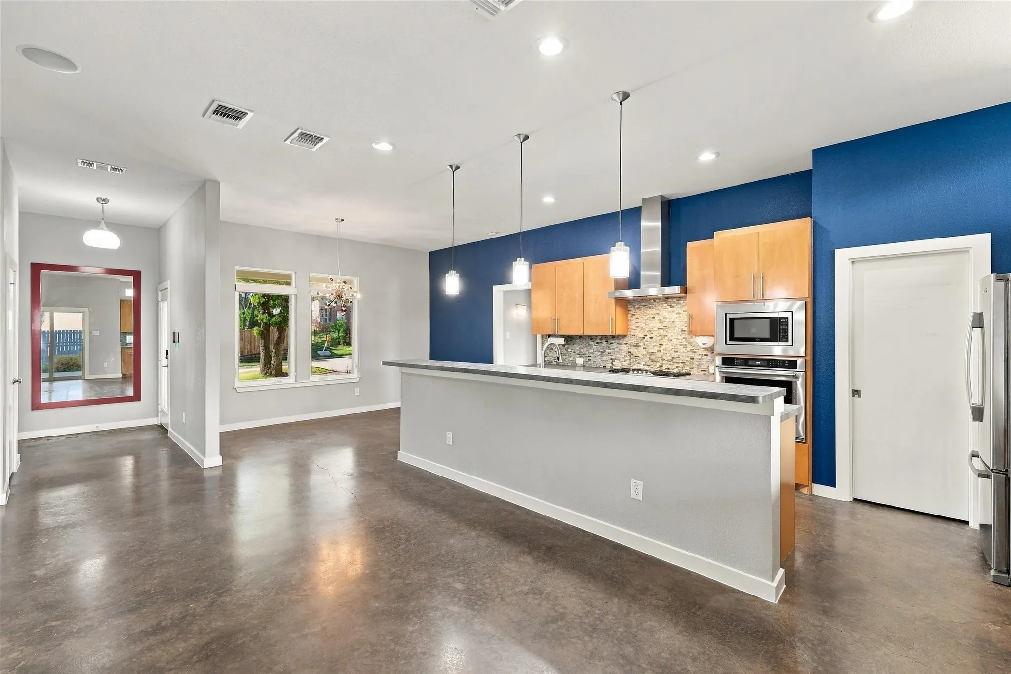 Sweeping open plan with concrete floors.