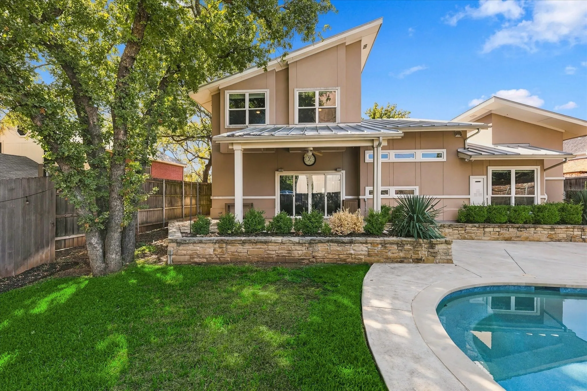 Backyard has a large cov'd patio, sport pool with lots of cooldecking &  grassy yard for the pets or kiddos. Very private & quiet too!