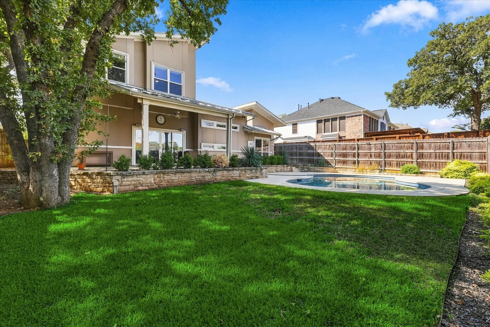 Backyard has a large cov'd patio, sport pool with lots of cooldecking &  grassy yard for the pets or kiddos. Very private & quiet too!