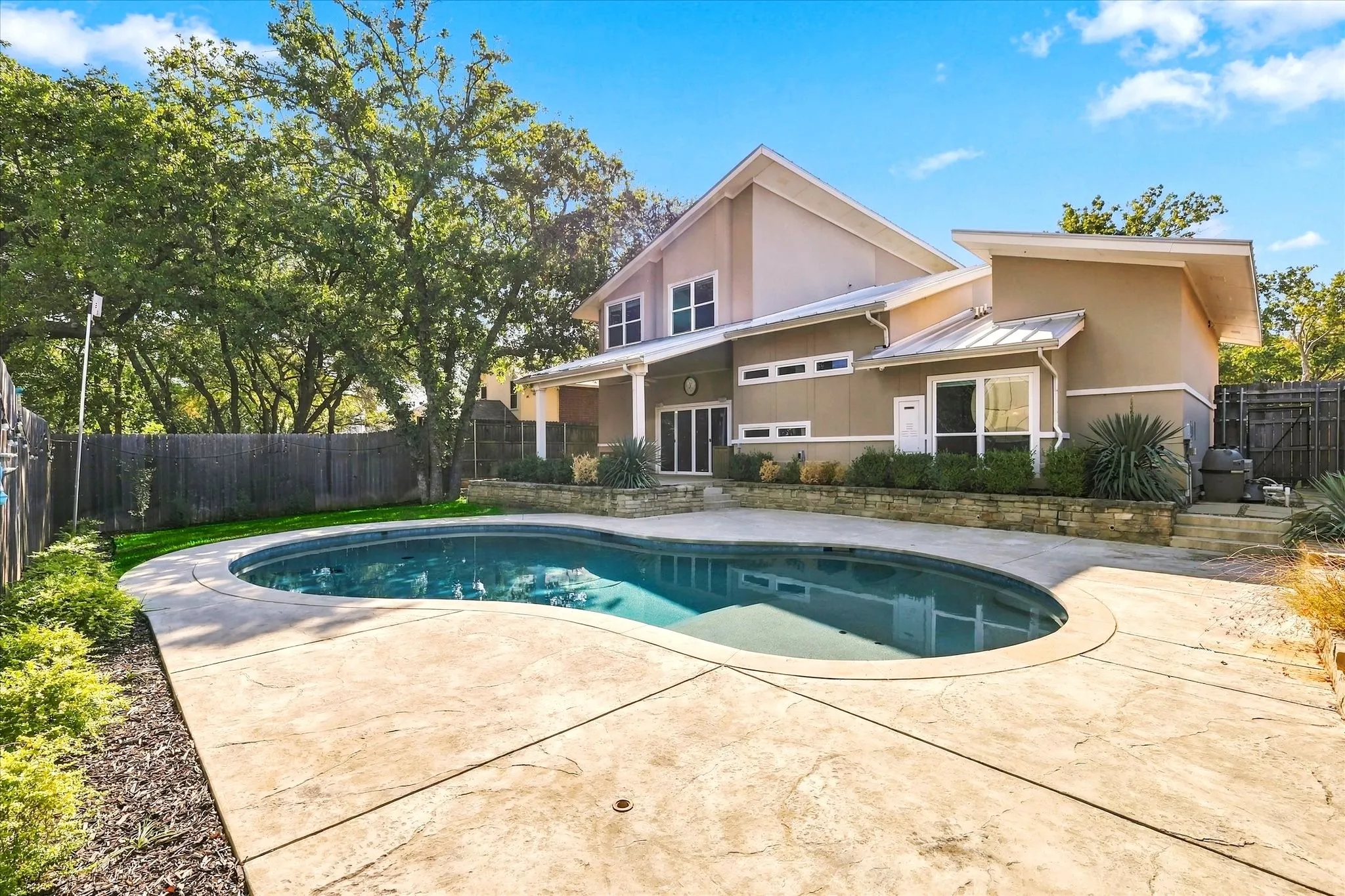 Backyard has a large cov'd patio, sport pool with lots of cooldecking &  grassy yard for the pets or kiddos. Very private & quiet too!