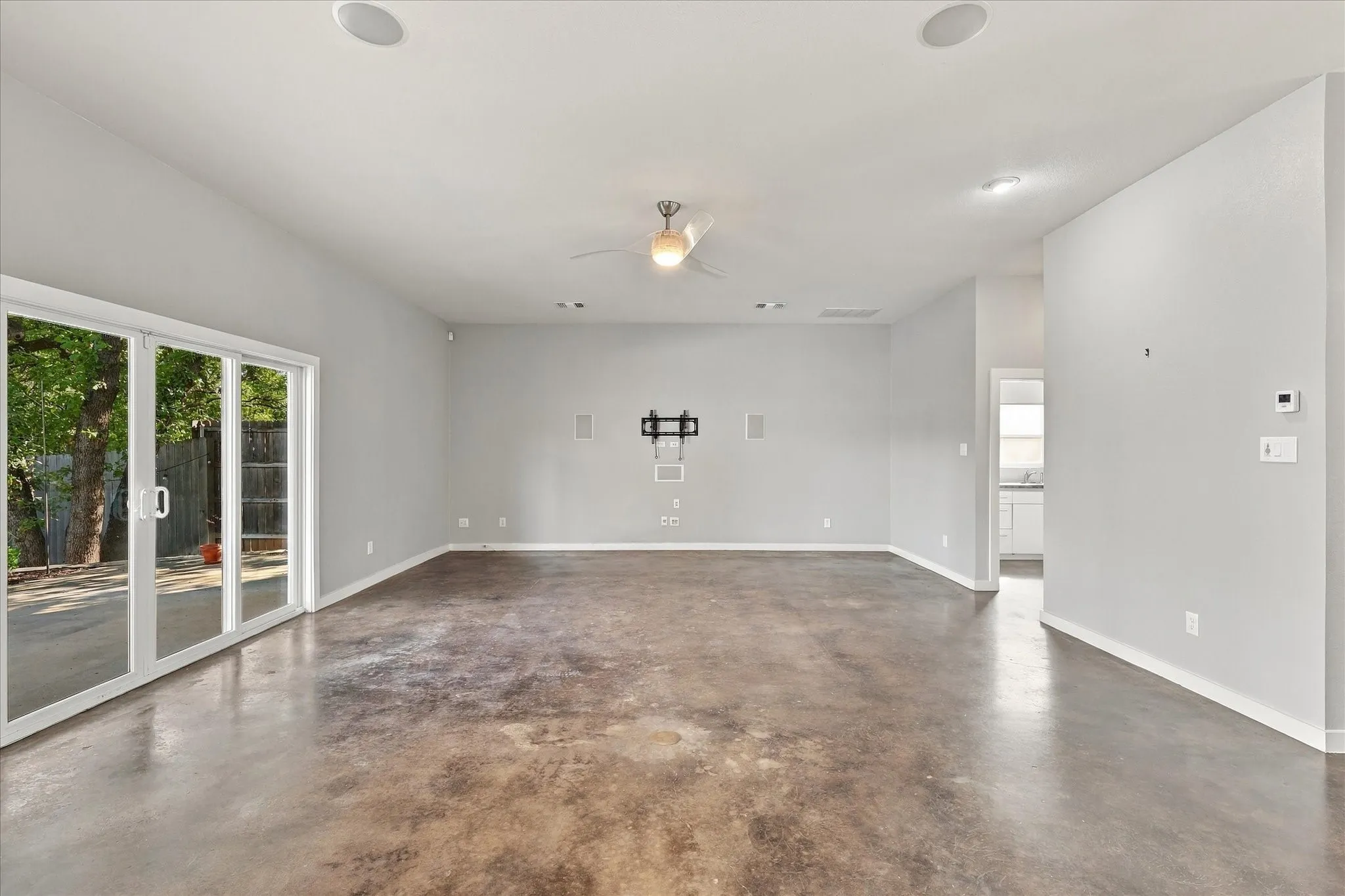Current picture of open & light floor plan. Living & kit area views the pool & back yard covered patio.