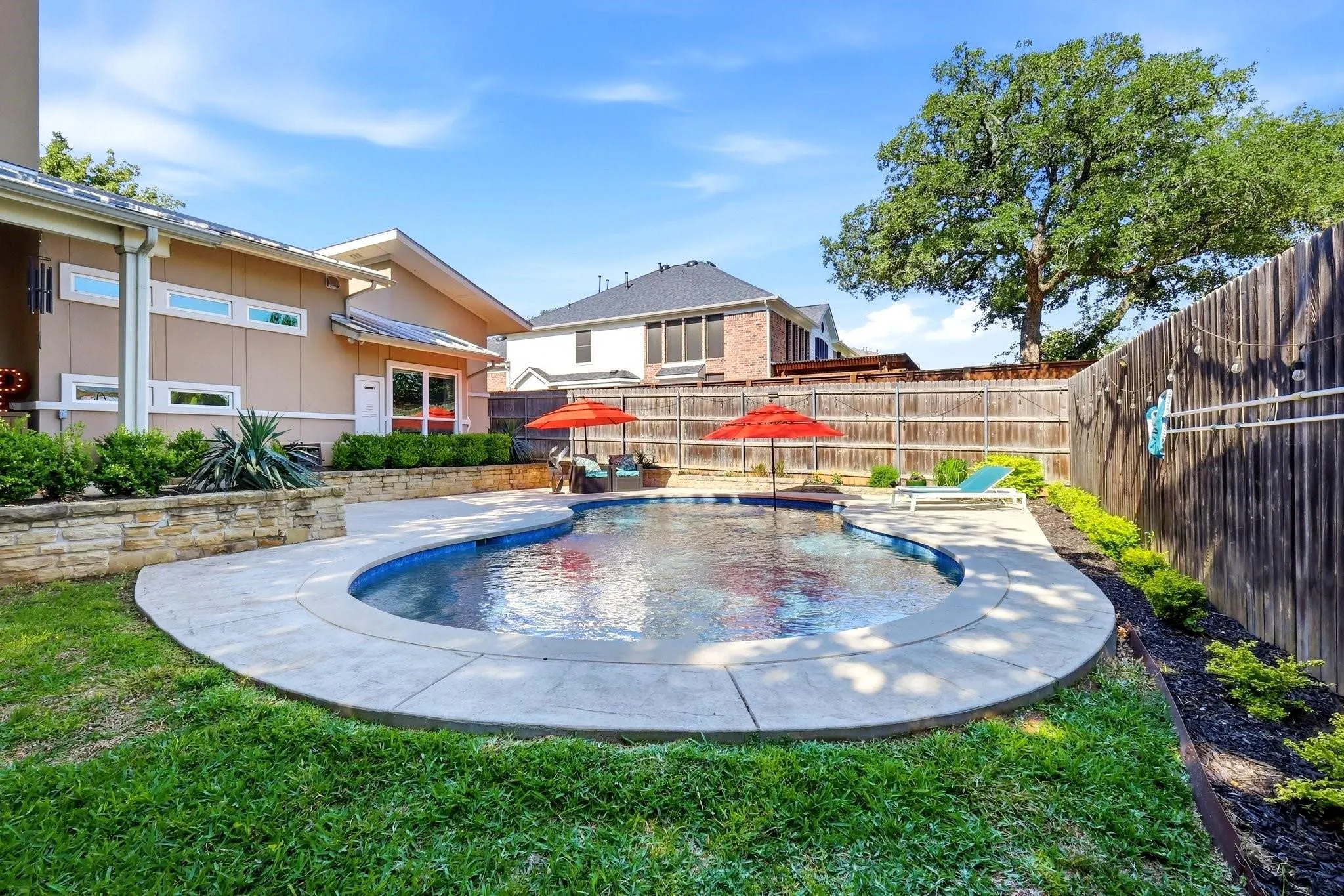 Backyard has a large cov'd patio, sport pool with lots of cooldecking &  grassy yard for the pets or kiddos.
