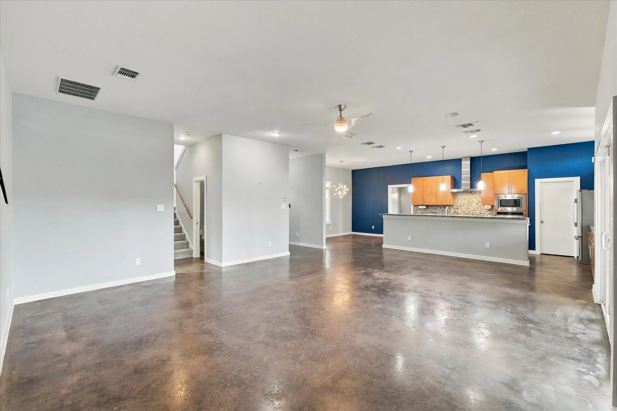 Current picture of open & light floor plan. Living & kit area views the pool & back yard covered patio.