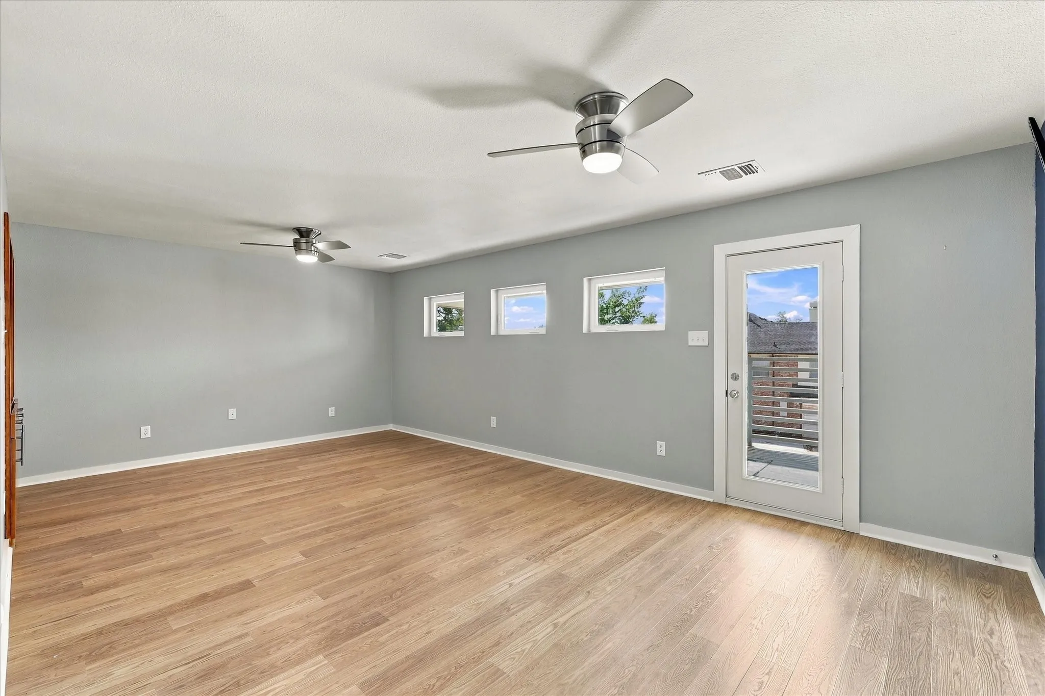 Loft leads to this game room which has a balcony off of it.