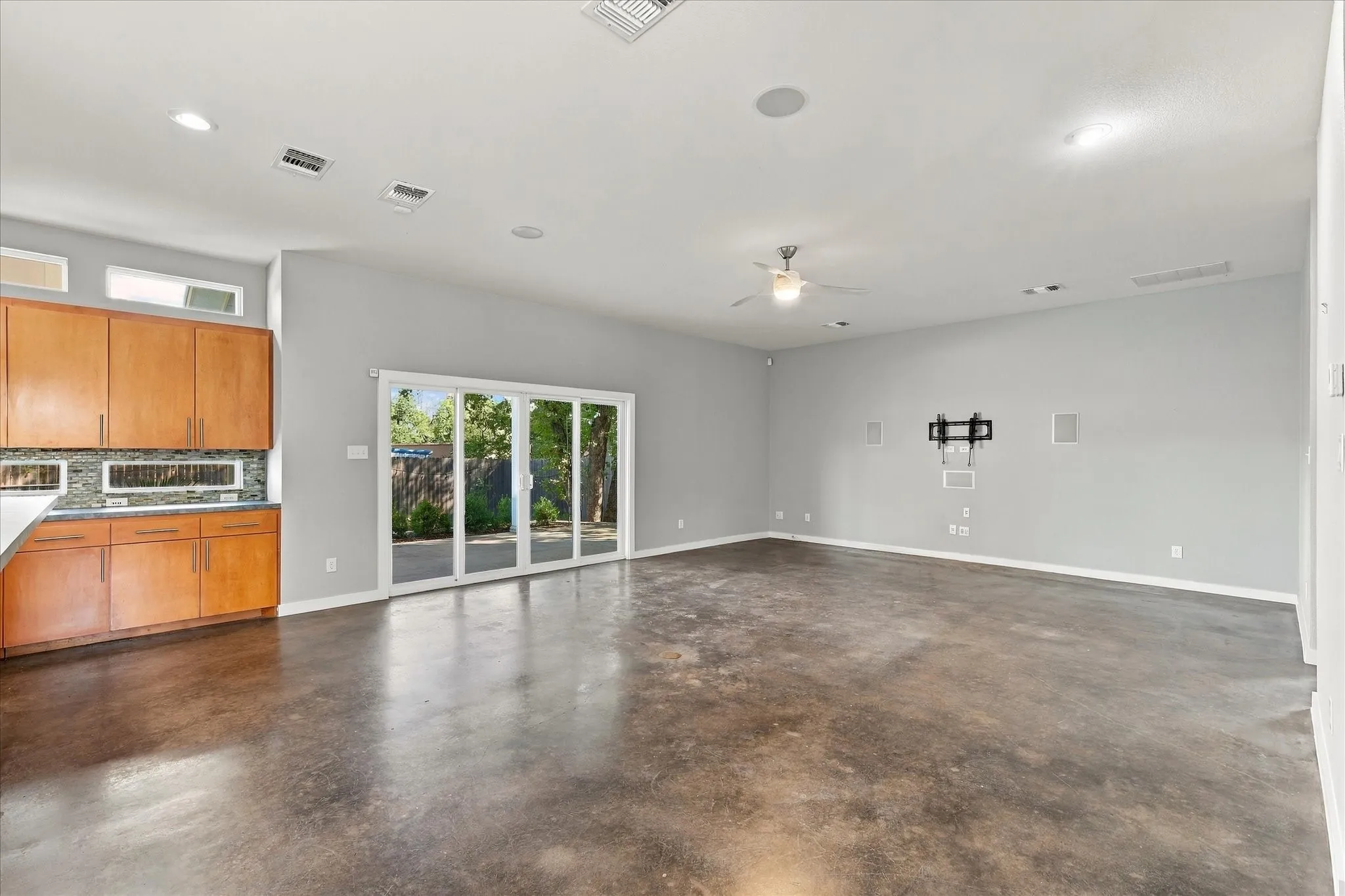 Current picture of open & light floor plan. Living & kit area views the pool & back yard covered patio.