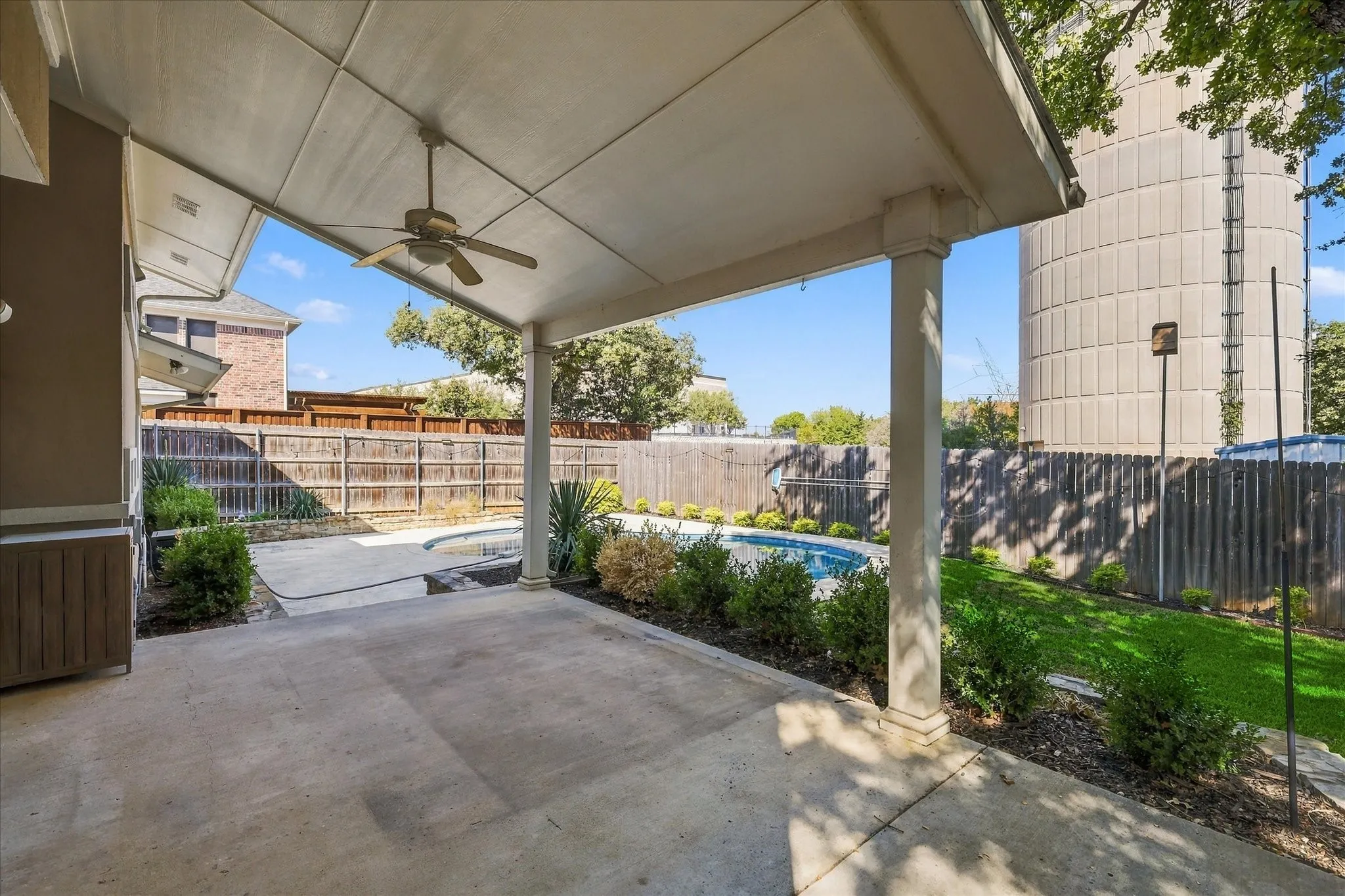 Backyard has a large cov'd patio, sport pool & plenty of grassy yard for the pets or kiddos. Very private & quiet too!