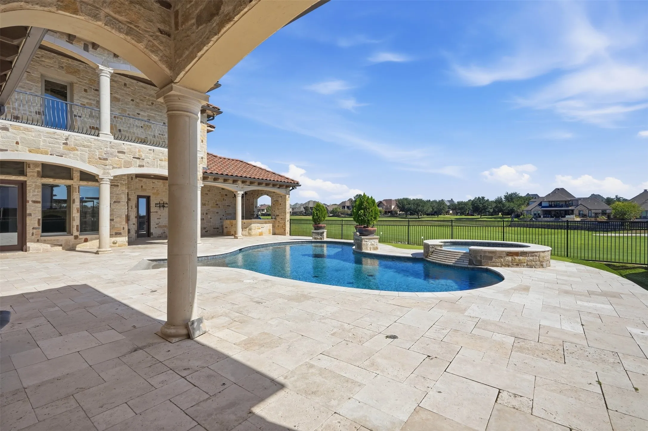 Enjoy your incredible hardscaped patio with motorized screens to keep the bugs out, while appreciating a stunning pool and golf course view!