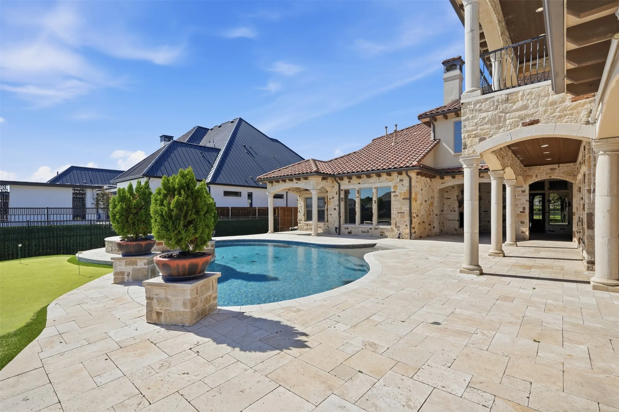 View of the pool and primary suite wing