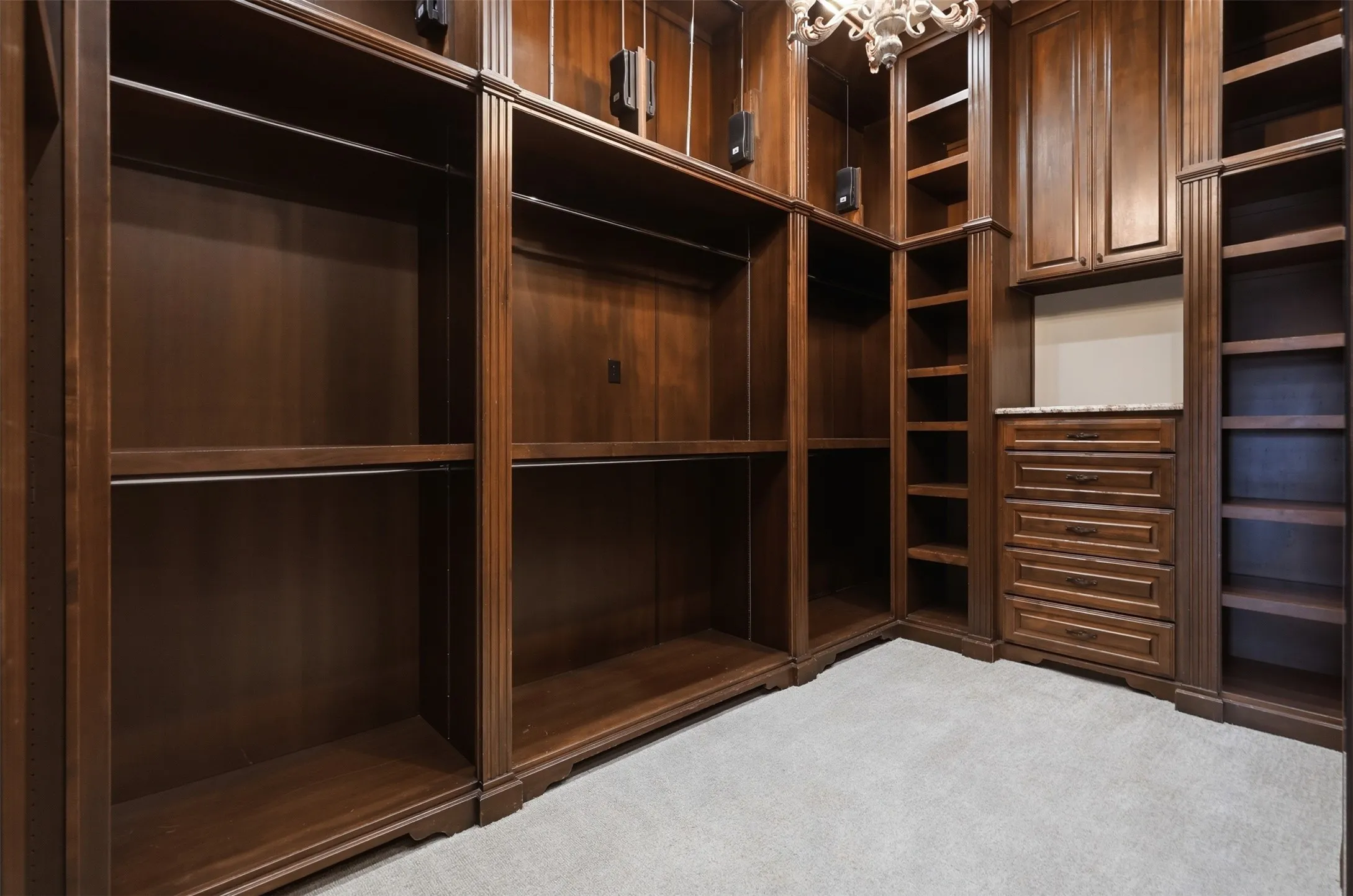This primary closet is all you could ever need! A dedicated accessory closet offers boutique-style storage for shoes, purses, and personal treasures — a truly one-of-a-kind feature. Believe it or not, this is only ONE of the two primary closets!  The other is incredibly spacious with tons of shoe storage.