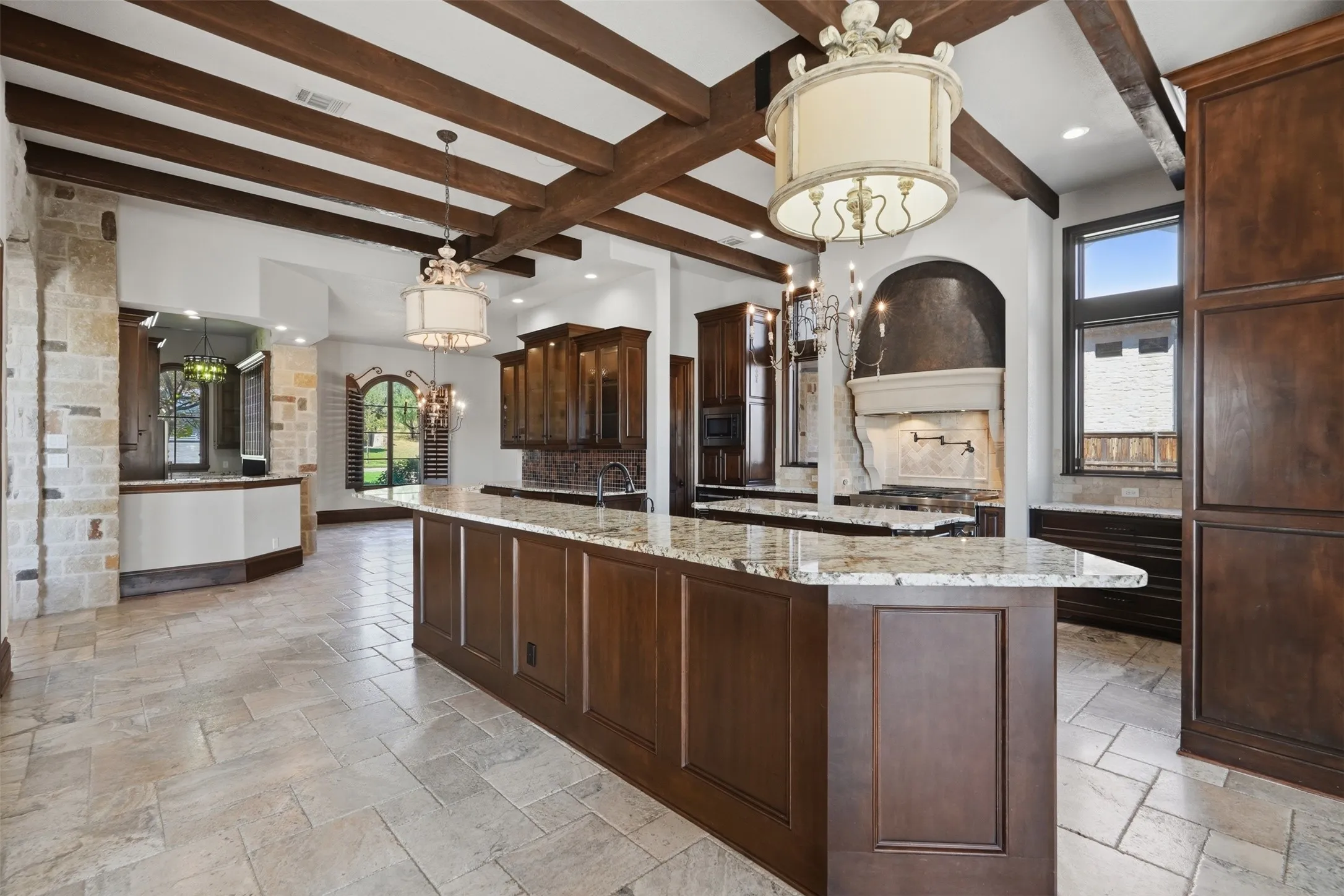 The soaring wood beamed ceiling adds a dramatic architectural element to the space.
