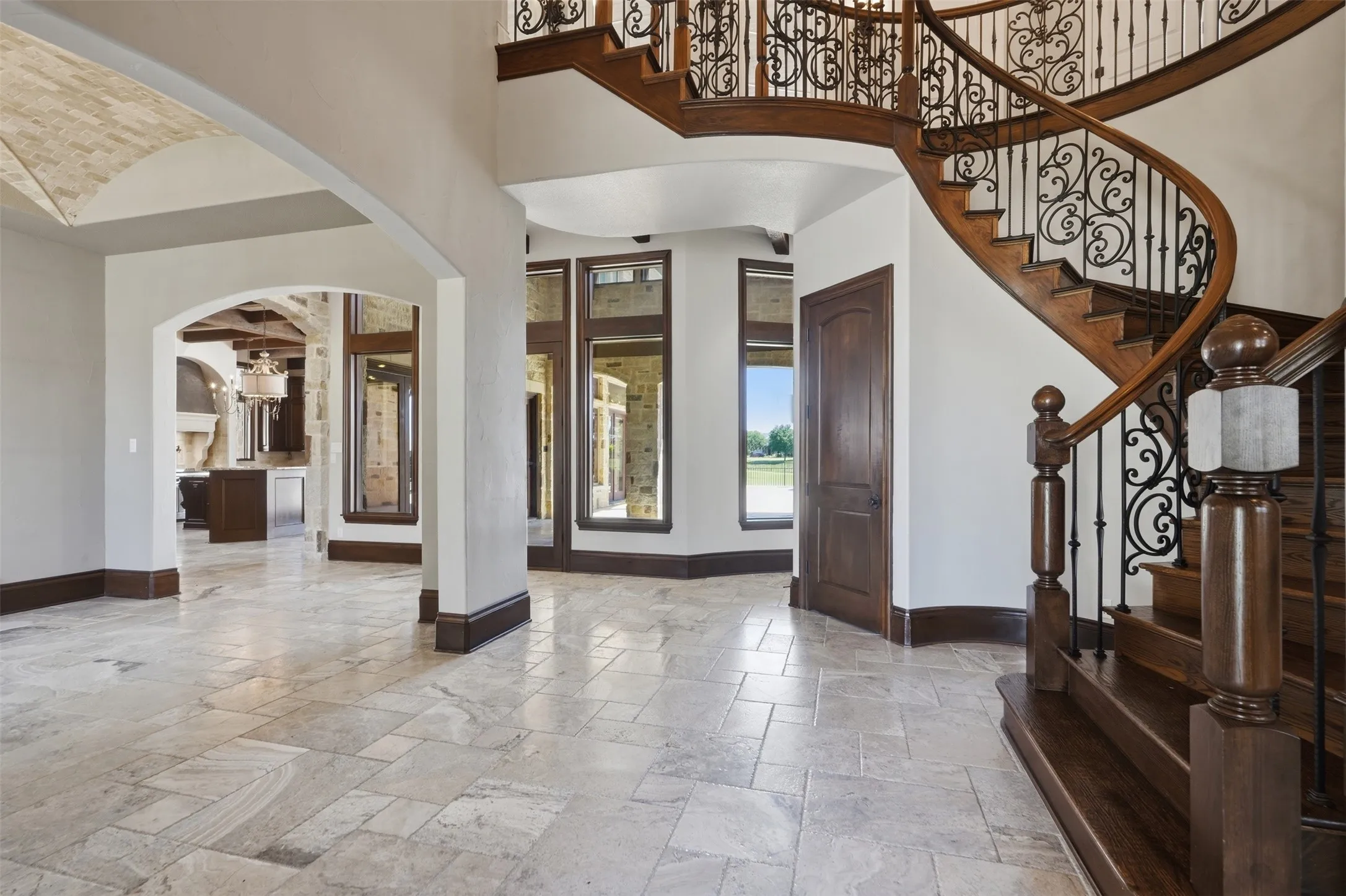 The entry is light and bright with picturesque views of the outdoor patios, pool and fairway.