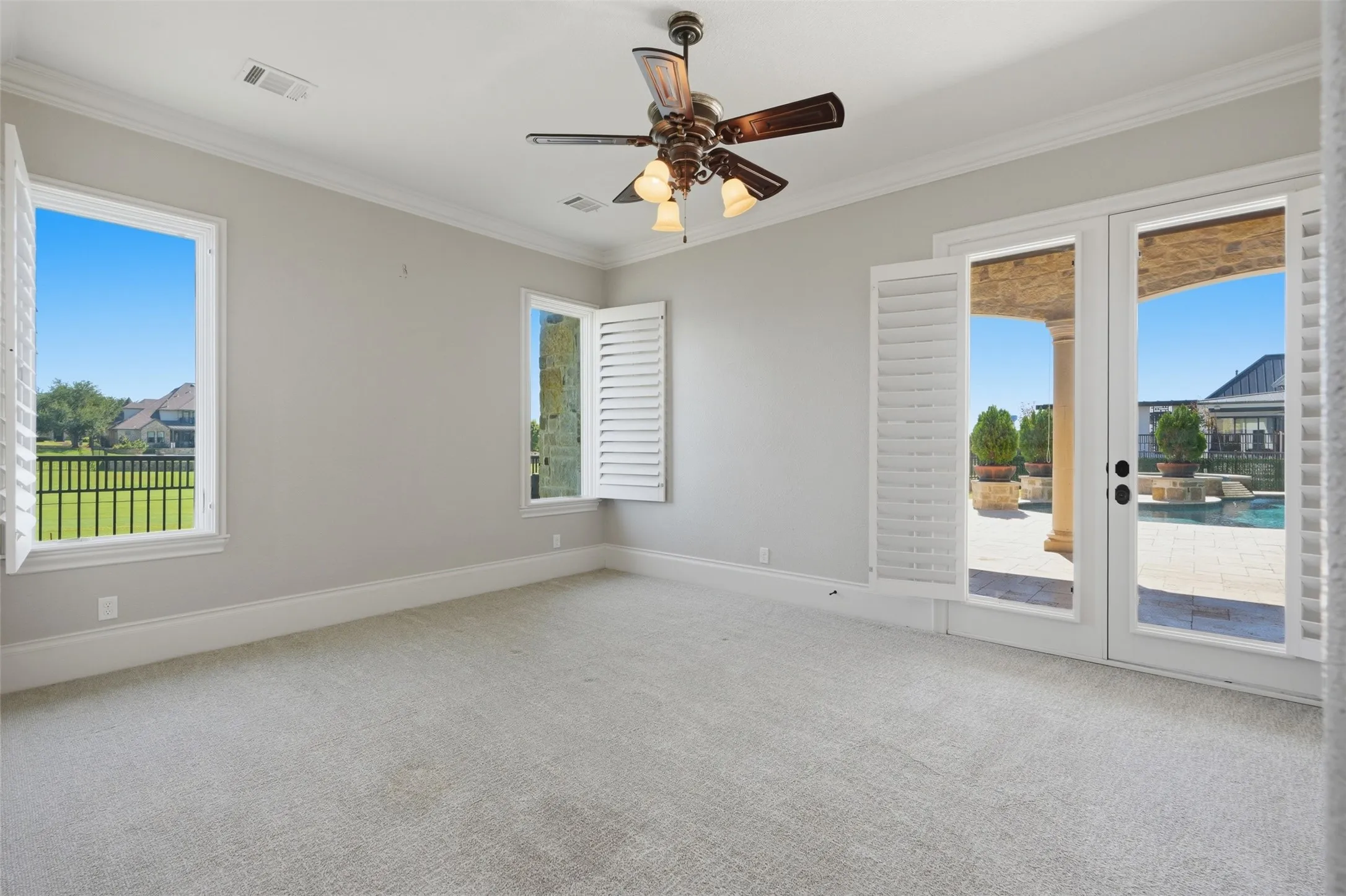 The downstairs guest suite features private outdoor access, a dedicated coffee bar with refrigerator and sink, and a beautifully appointed en-suite bath.