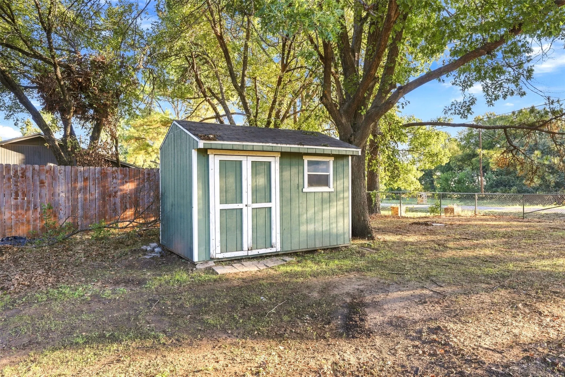 Storage Shed – Detached 12x8 shed with double doors provides additional storage space.