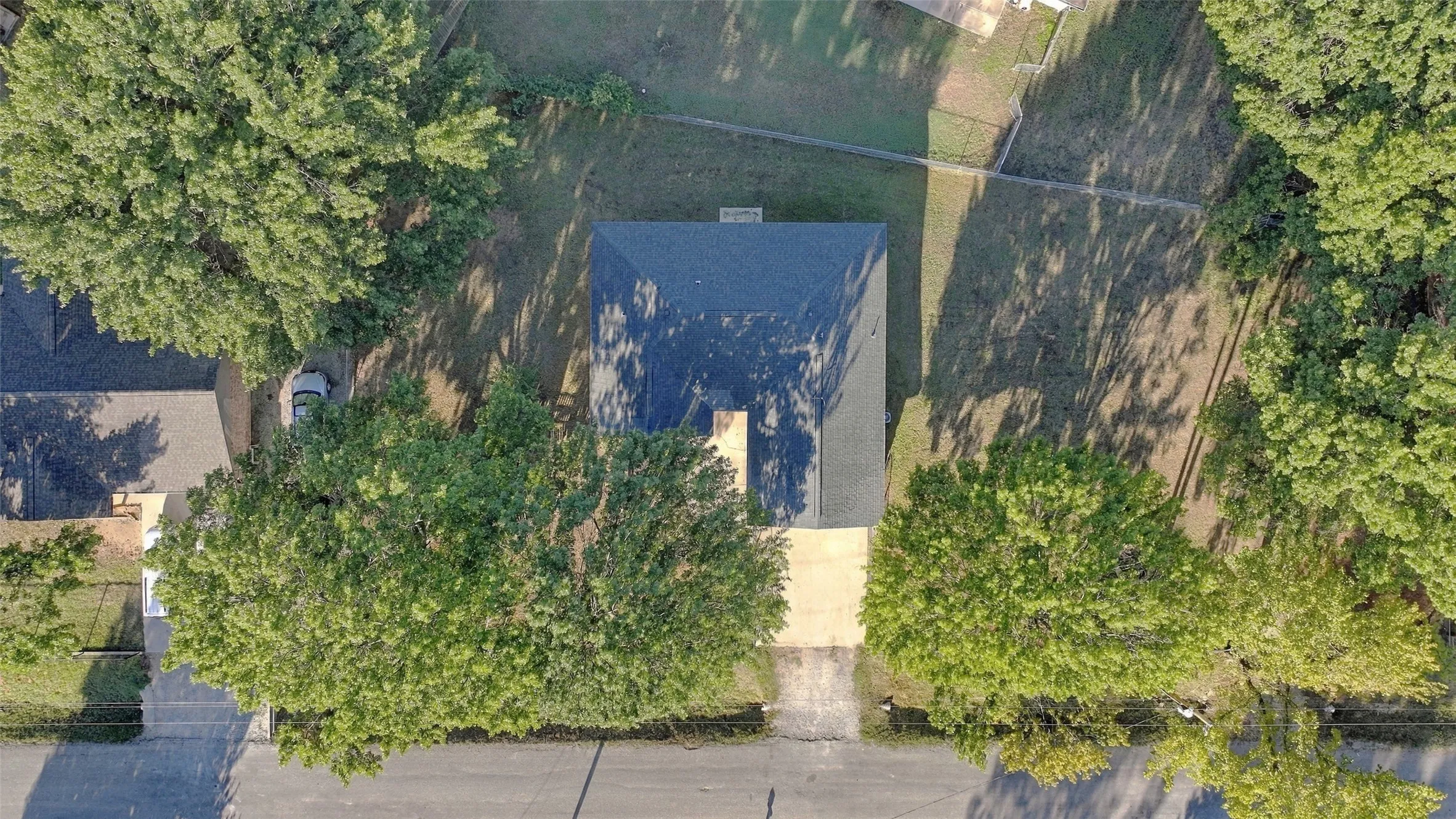 Overhead Aerial – Bird's-eye view highlights the home's layout and surrounding 0.421-acre double lot.