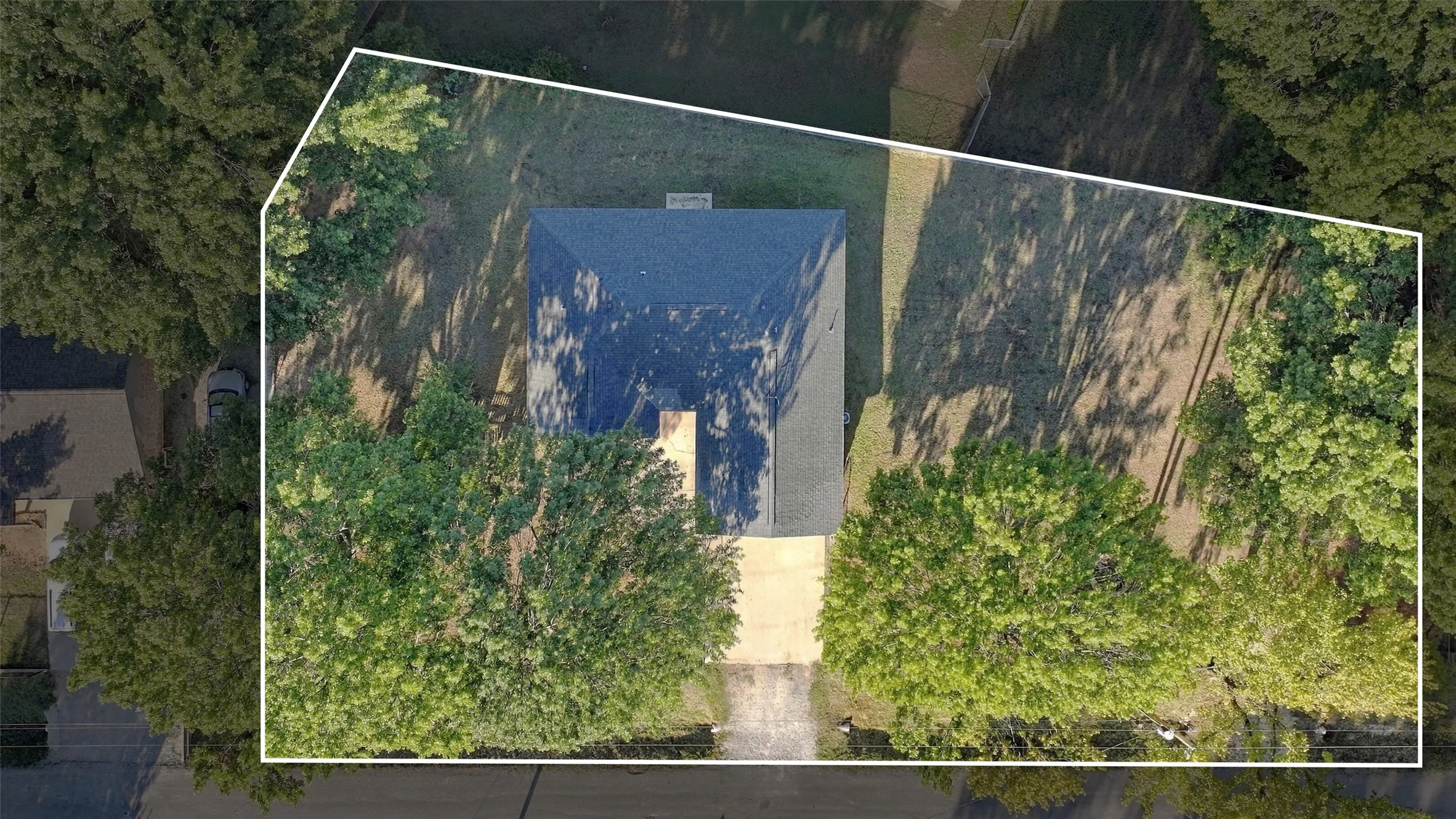Aerial View – Spacious 0.421-acre double lot surrounded by mature trees.