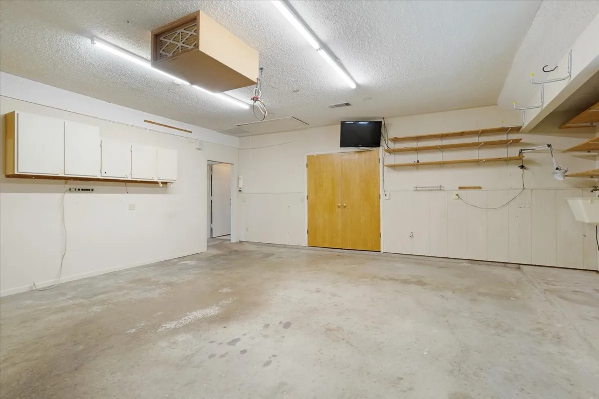 This is the original garage attached to the house. It has HVAC. A separate attached garage is attached to this space.