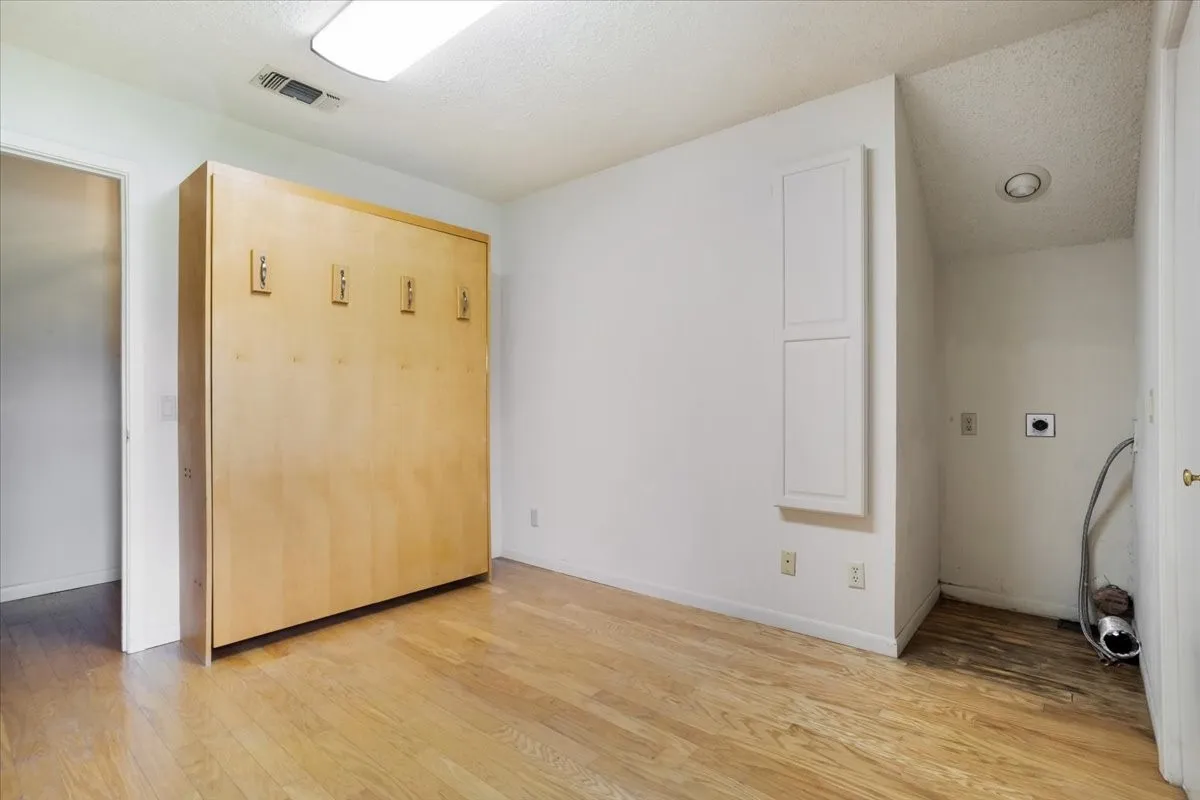 This is considered the 4th bedroom. It has a murphy bed and is set up for a stackable washer and dryer if wanted