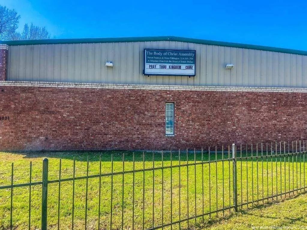 Red brick exterior with metal paneling